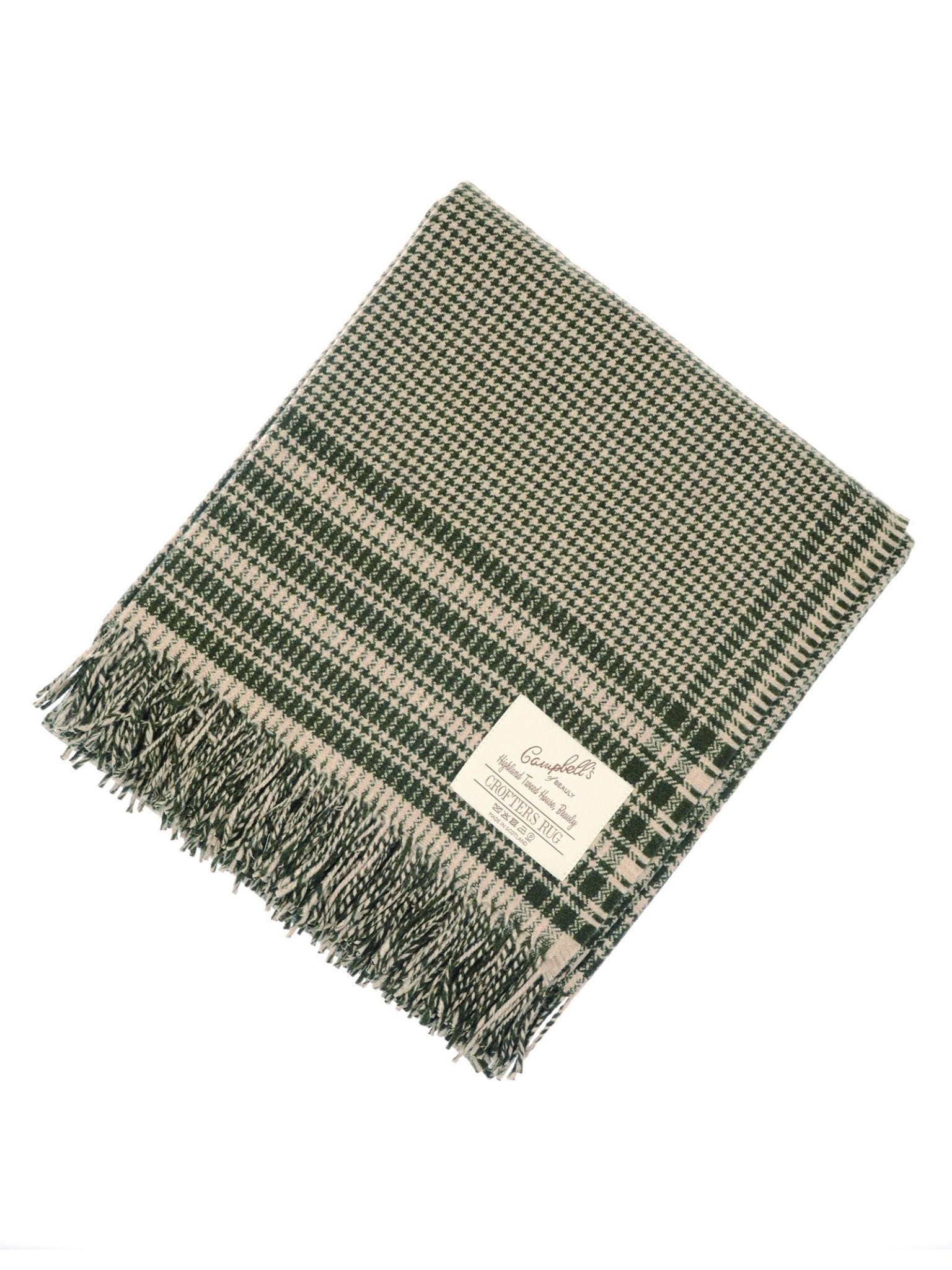 A folded Campbell's of Beauly Crofters Blanket in green with a houndstooth pattern, fringed edges, and a corner label—ideal for adding country charm to your home.