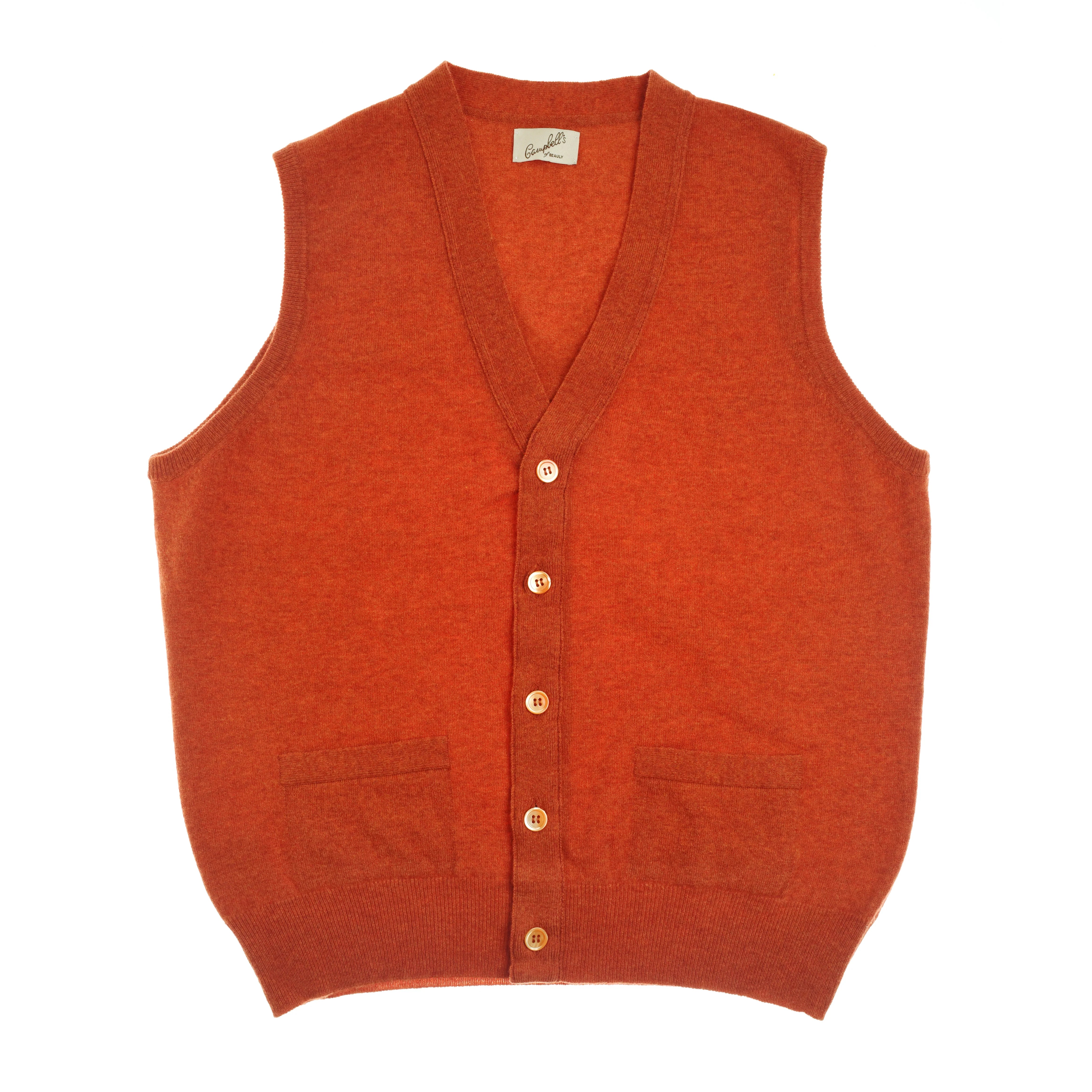 The Campbell's of Beauly Auld Stock Geelong Lambswool Button Waistcoat in Ember is sleeveless with two front pockets and a V-neck, offering classic country style. Laid flat on a white background.