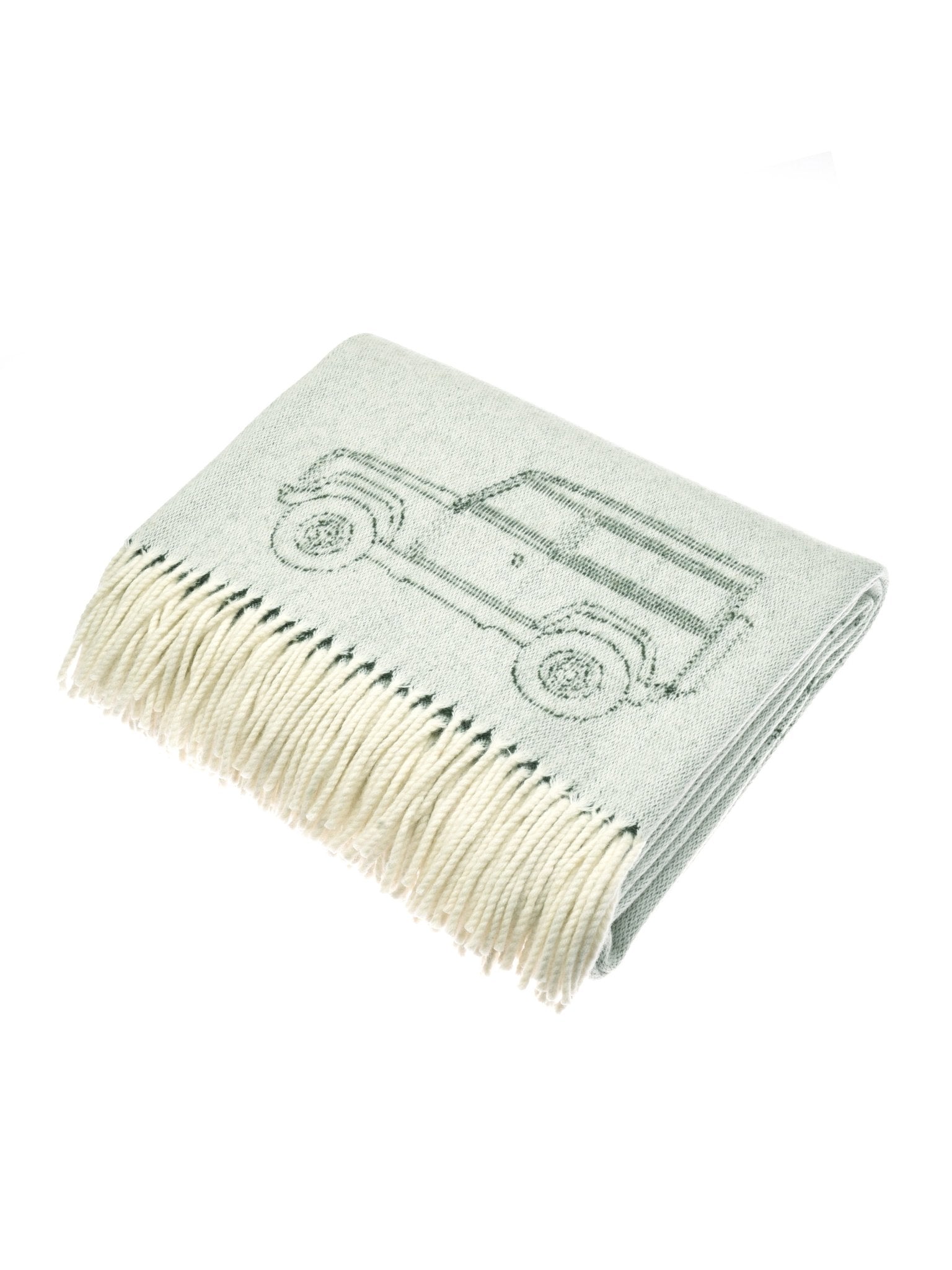 The Campbells of Beauly Land Rover Defender Jacquard Throw is a light gray wool blanket with cream fringe, featuring a simple classic Defender line drawing.
