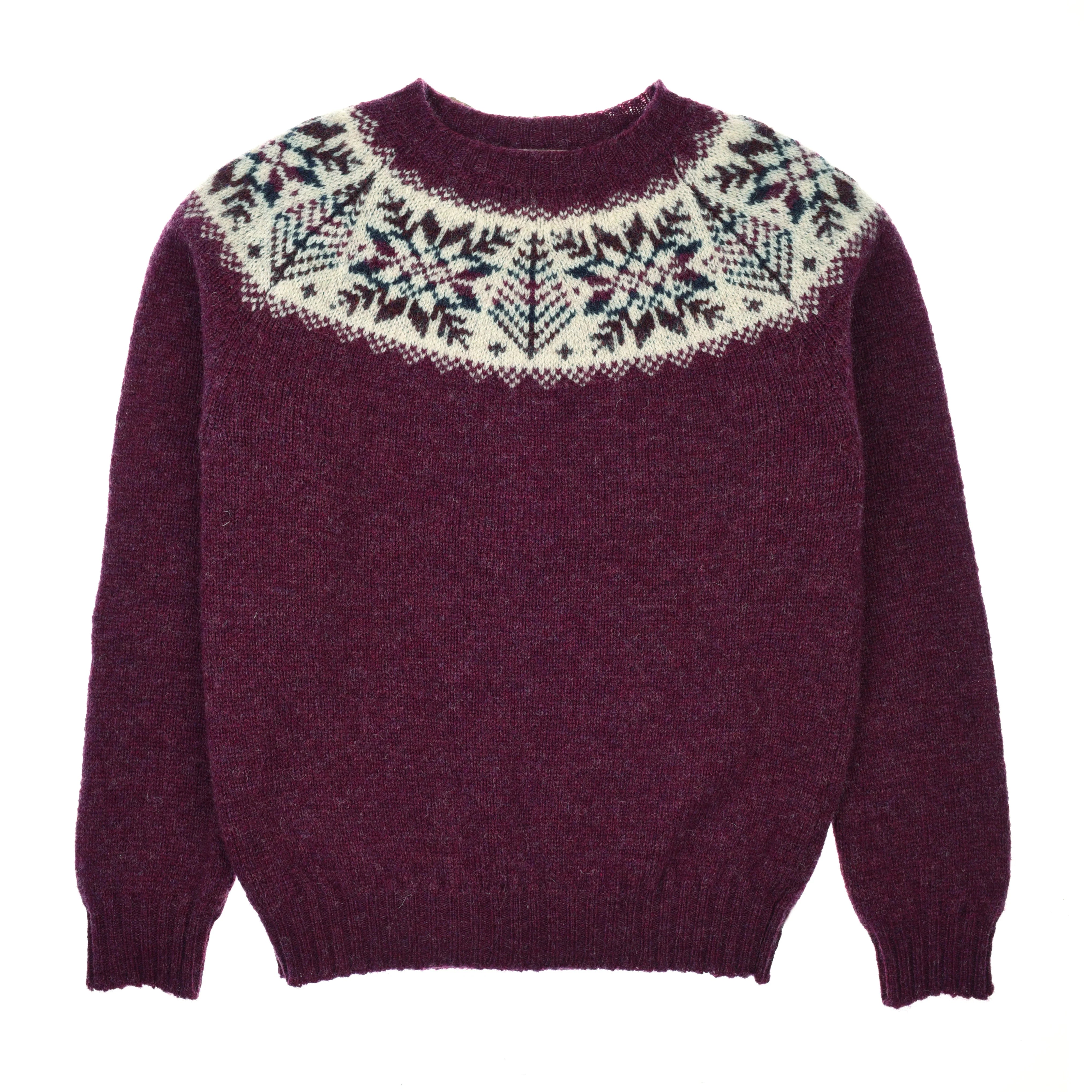 The Shetland Snowflake Crew Jumper by Campbell's of Beauly is a berry Fairisle sweater with a round neckline and white yoke, featuring colorful Nordic-inspired snowflake patterns—perfect cozy winter knitwear.