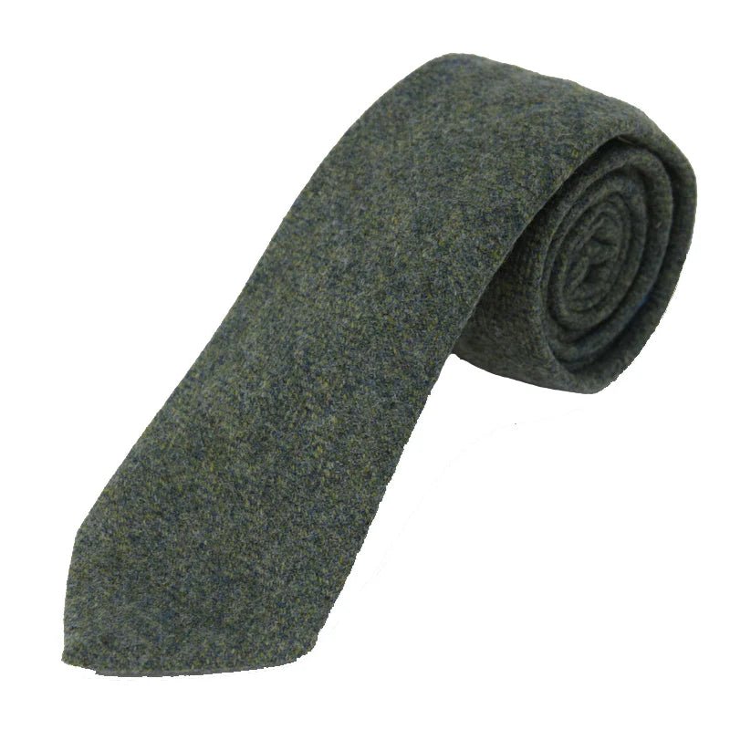 The Campbells of Beauly Tweed Tie in Lovat Green features textured wool, handmade craftsmanship, and classic country style, shown rolled up on a white background.