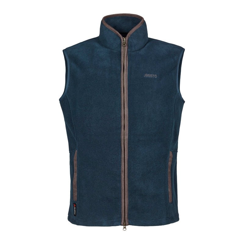 The Musto Fenland Polartec® Vest in navy features advanced fleece, a brown zipper and trim, two zippered front pockets, a raised collar, and subtle Musto embroidery on the left chest.