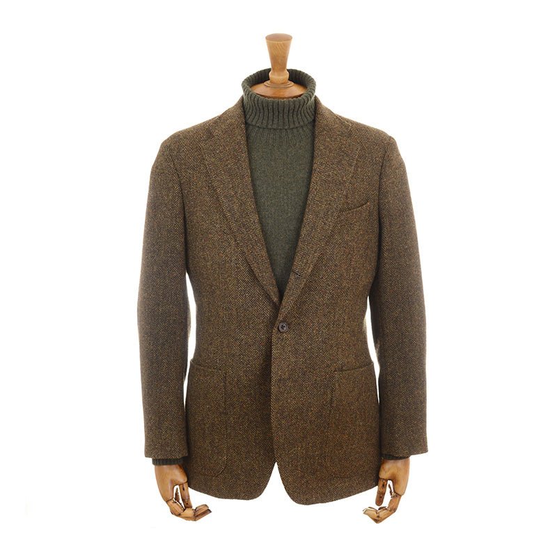 The Campbells of Beauly Brown Donegal House Jacket is shown on a mannequin over an olive green turtleneck, set against a plain white background.