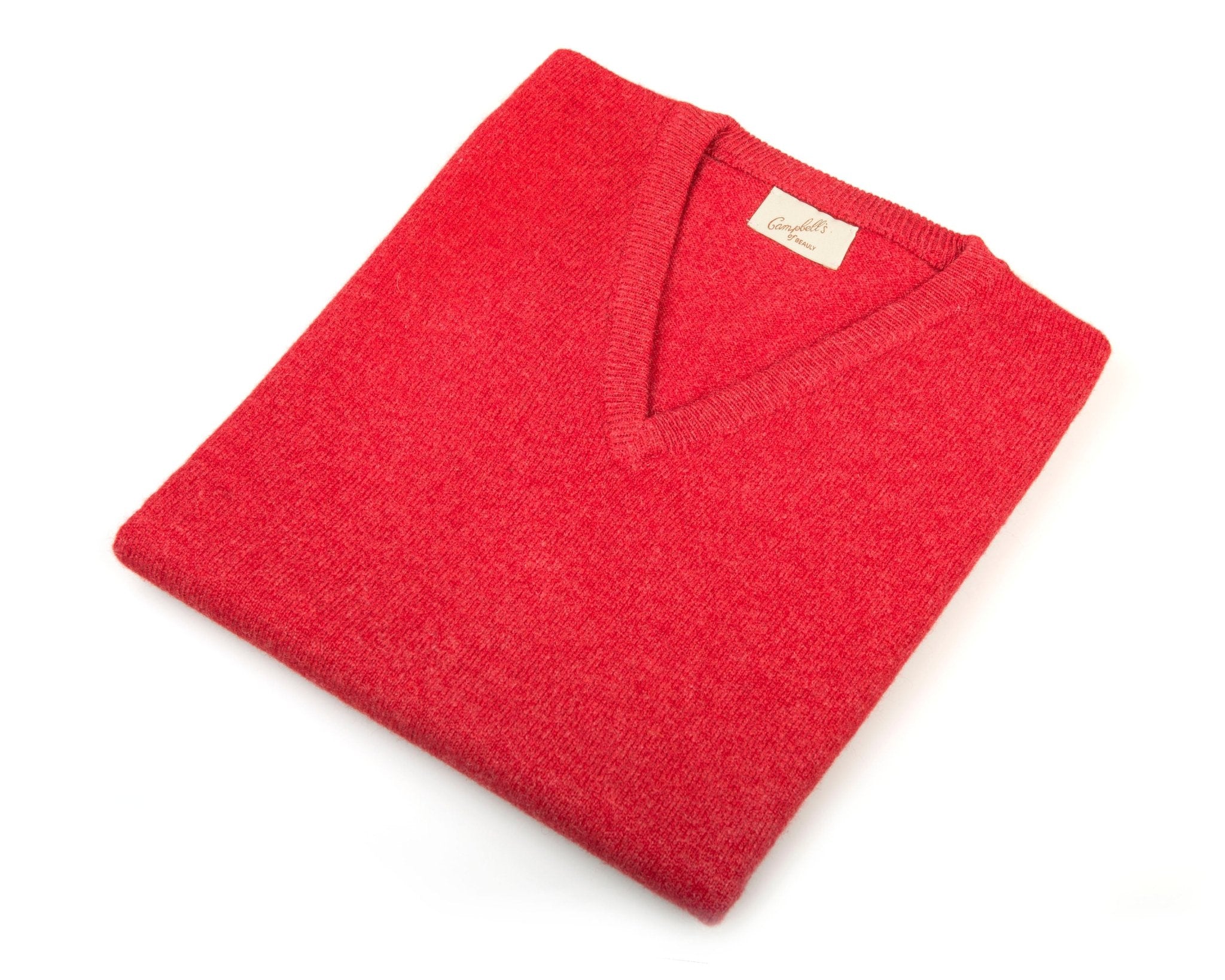A neatly folded red Lambswool V-Neck Slipover by Campbells of Beauly, classic fit and inspired by the Scottish Borders, features a visible beige label and is displayed on a white background.