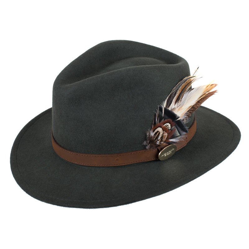 The Hicks & Brown Gamebird Fedora in Olive features wool felt, a brown leather band, and a cluster of brown and white feathers on the side.