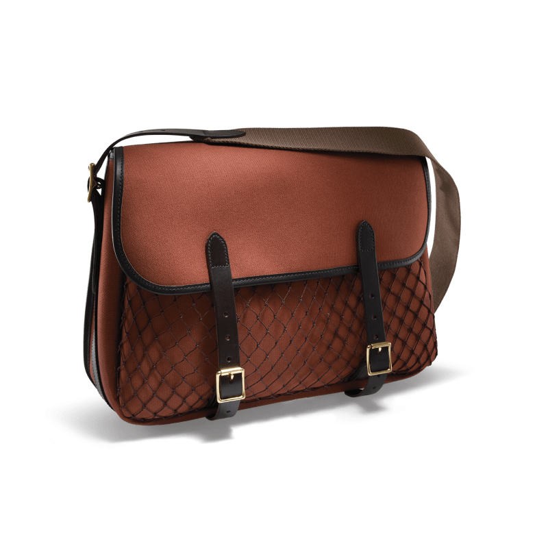 The Campbells of Beauly Game Bag is a tan messenger bag crafted from heavy-duty canvas, with a wide olive green shoulder strap, black leather trim, gold buckles, and a netted lower front—ideal for your outdoor essentials.
