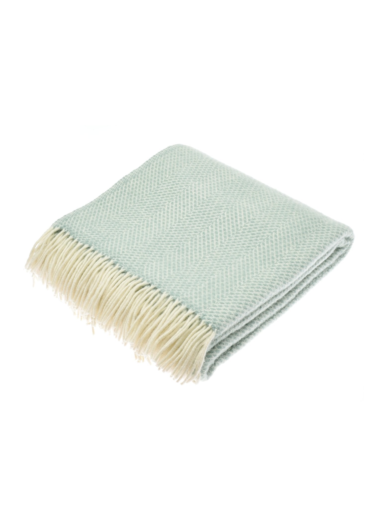 The Stipled Twill Blanket by Campbell's of Beauly features a light green herringbone wool design with cream fringe, shown neatly folded on a white background.