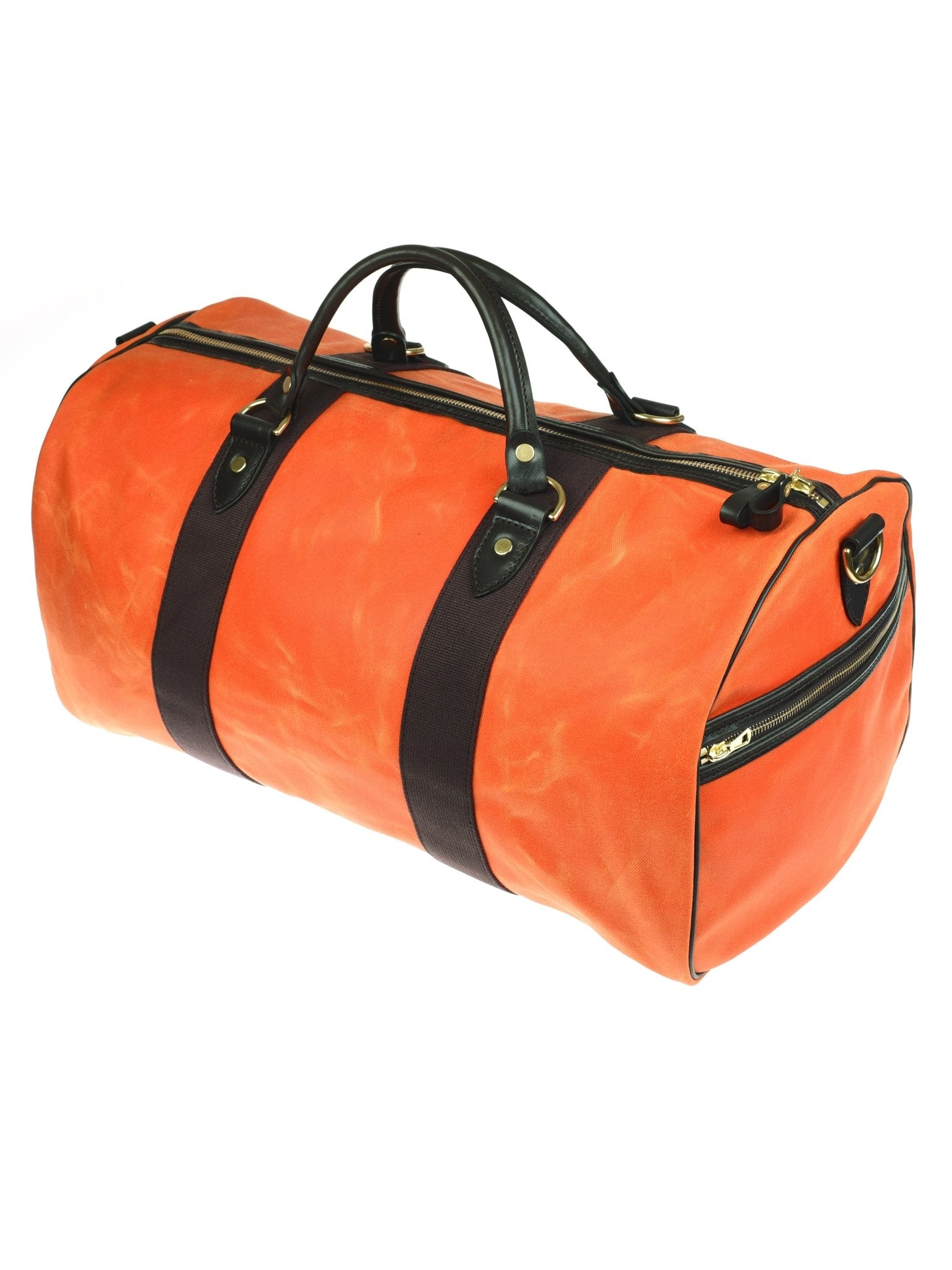 The Campbells of Beauly Wax Holdall is an orange waxed canvas bag with black bridle leather handles, black side straps, and gold-tone zipper and hardware accents, shown against a white background.