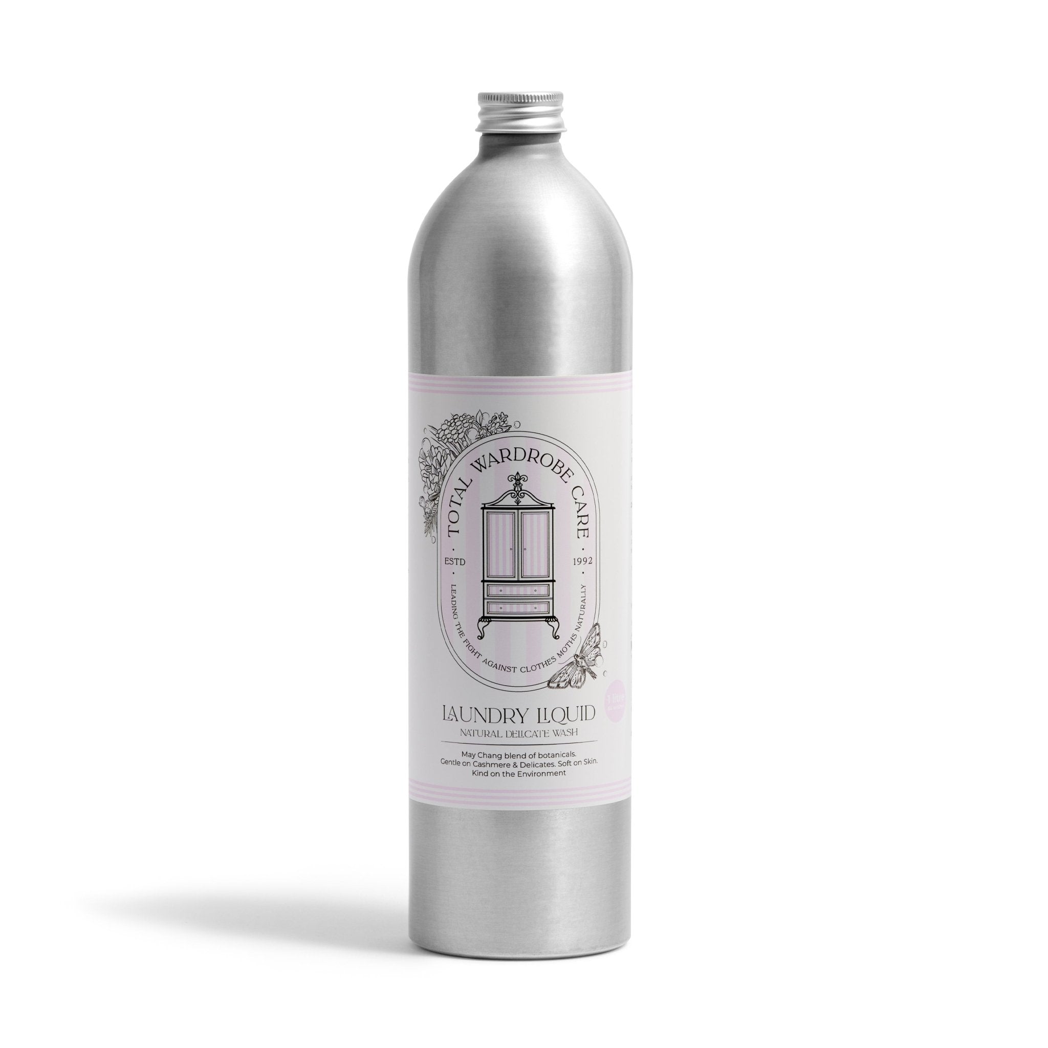 A silver bottle of Total Wardrobe Care Laundry Liquid features a vintage wardrobe illustration and minimalist, elegant design, offering non-biological detergent specially formulated for gentle care of wool and cashmere.