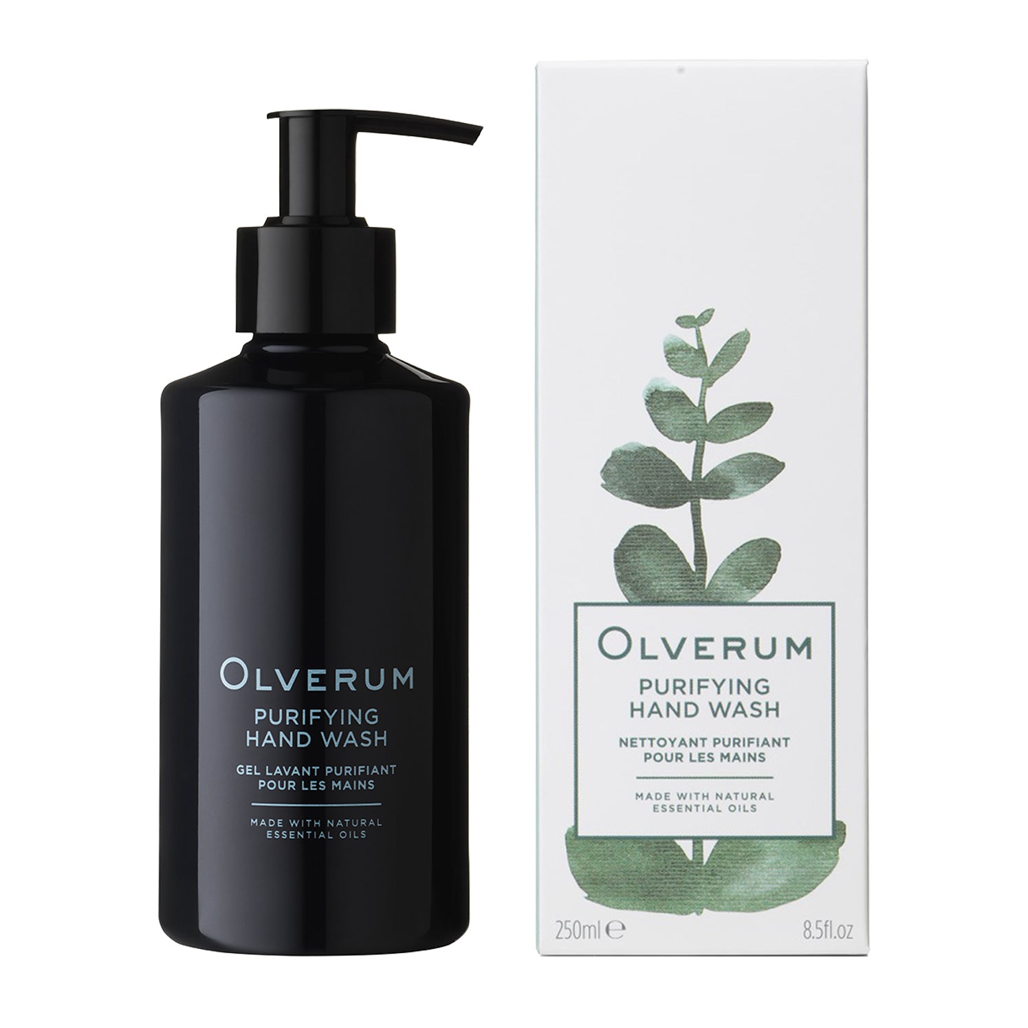 A black pump bottle labeled Olverum Purifying Hand Wash stands beside a white box with green watercolor leaves, featuring English and French details and highlighting its vegan-friendly formula.