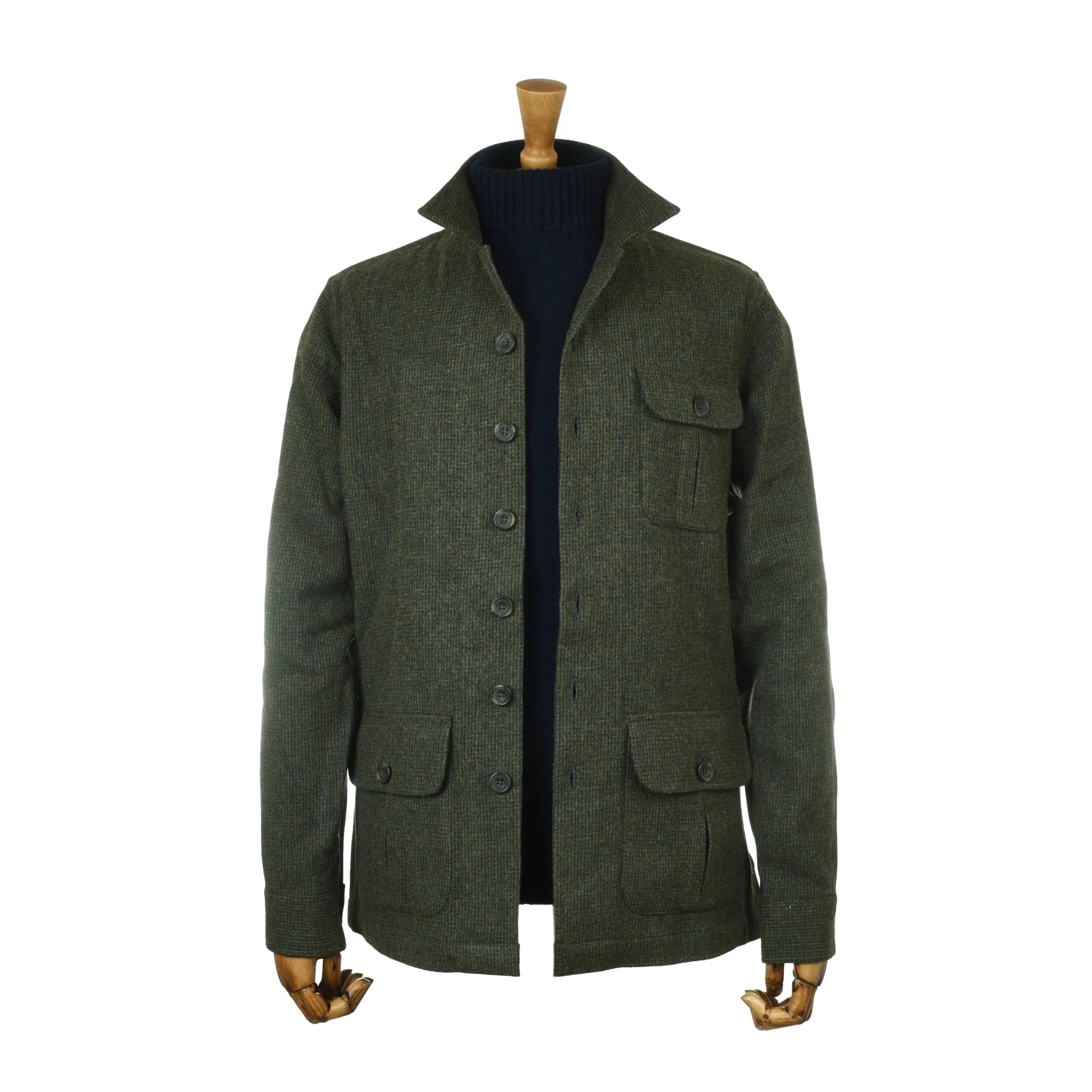 The Campbell's of Beauly Auld Stock Casual Tweed Shacket, in dark green wool with a stand collar, button front, and four flap pockets, is shown on a mannequin layered over a black turtleneck.