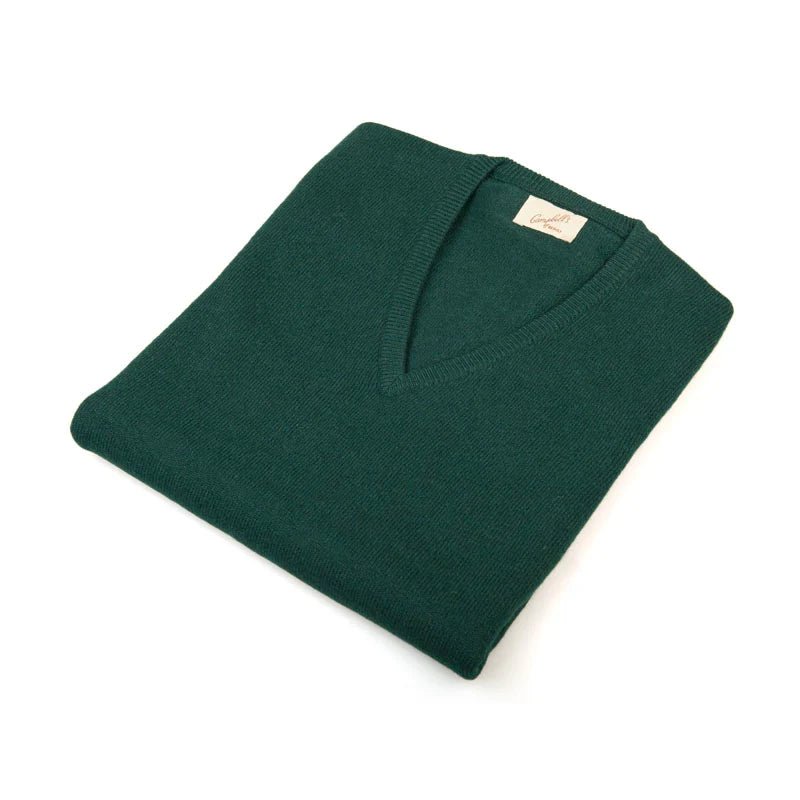 A neatly folded Campbell's of Beauly Auld Stock Cashmere Slipover in Bottle, a classic-fit knit V-neck sweater made in Scotland, is displayed on a white background with the label visible at the collar.