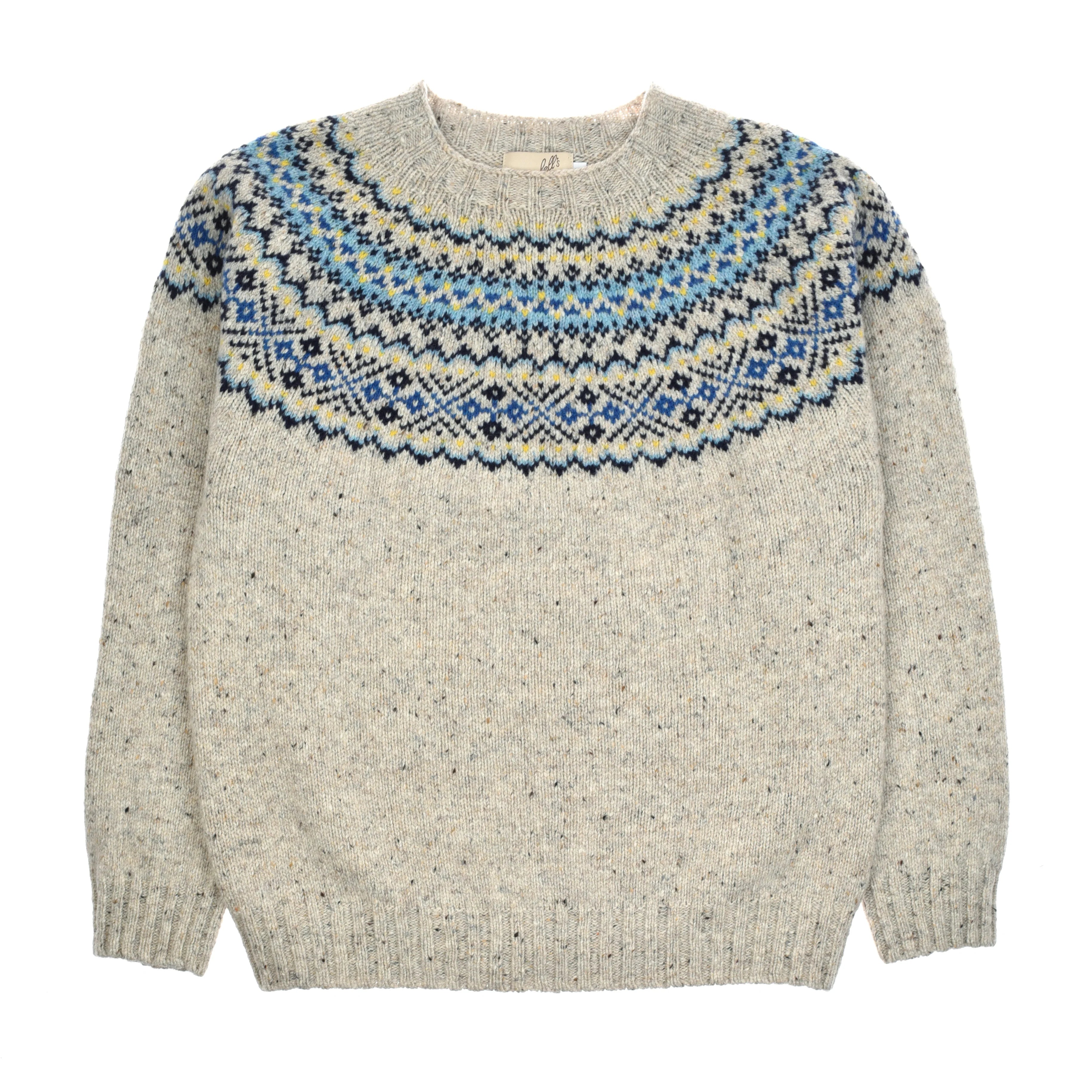 Introducing the Auld Stock Donegal Lambswool Fairisle Crew by Campbell’s of Beauly—a blue pure lambswool jumper featuring a round neckline and a classic Fairisle pattern across the shoulders and chest, inspired by traditional Donegal style.