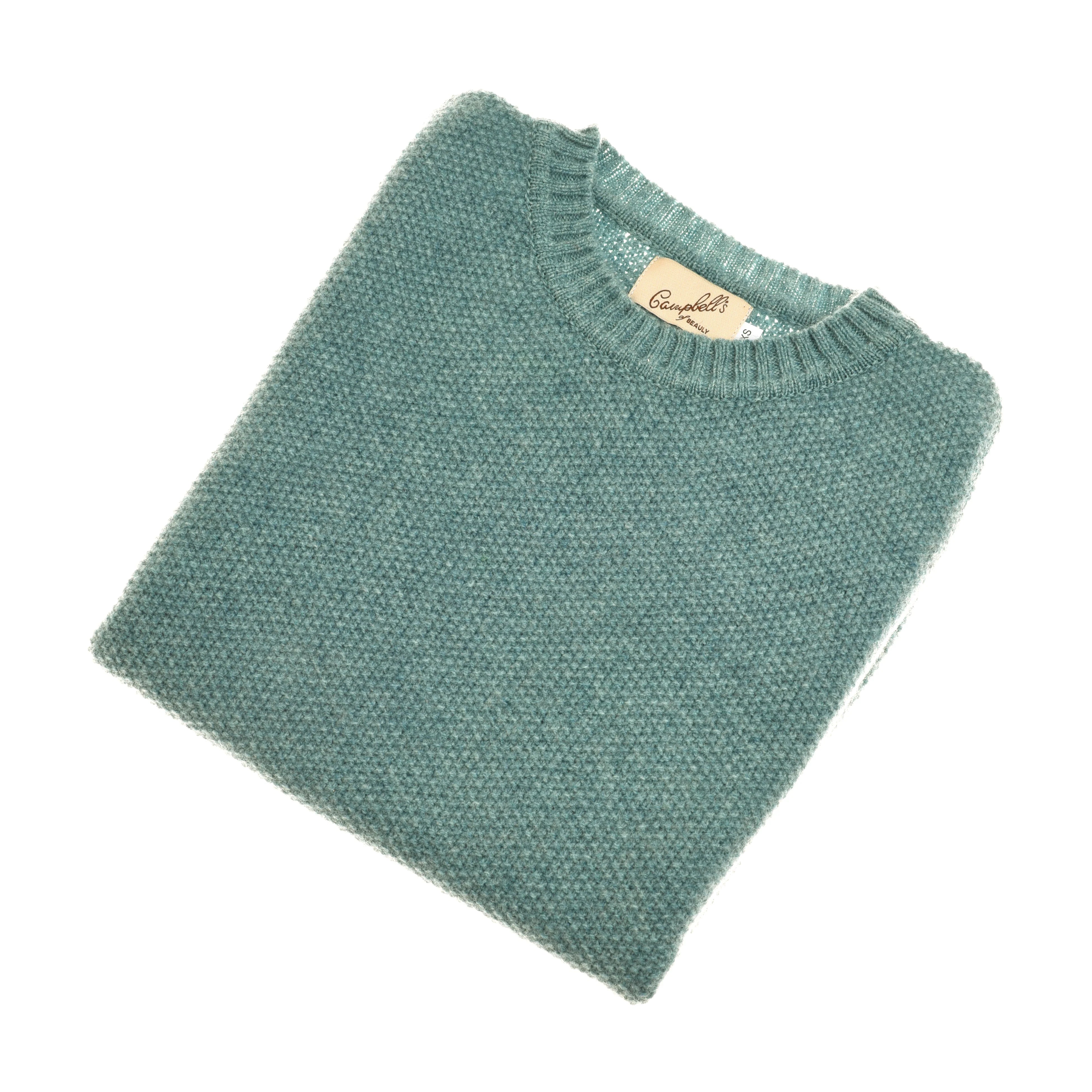 A neatly folded Moss Stitch Crew Tank by Campbell's of Beauly, in fine gauge light blue-green knit with textured detail and visible label, crafted in Scotland and displayed on a white background.