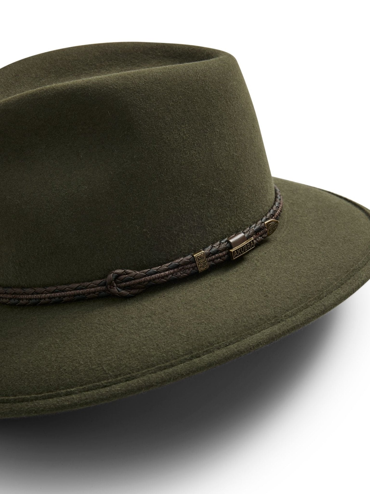The Unisex Akubra Traveller Hat by Akubra is an olive green felt wide-brim hat with a dark braided rope band and metallic accents, made in Australia and displayed on a plain white background.