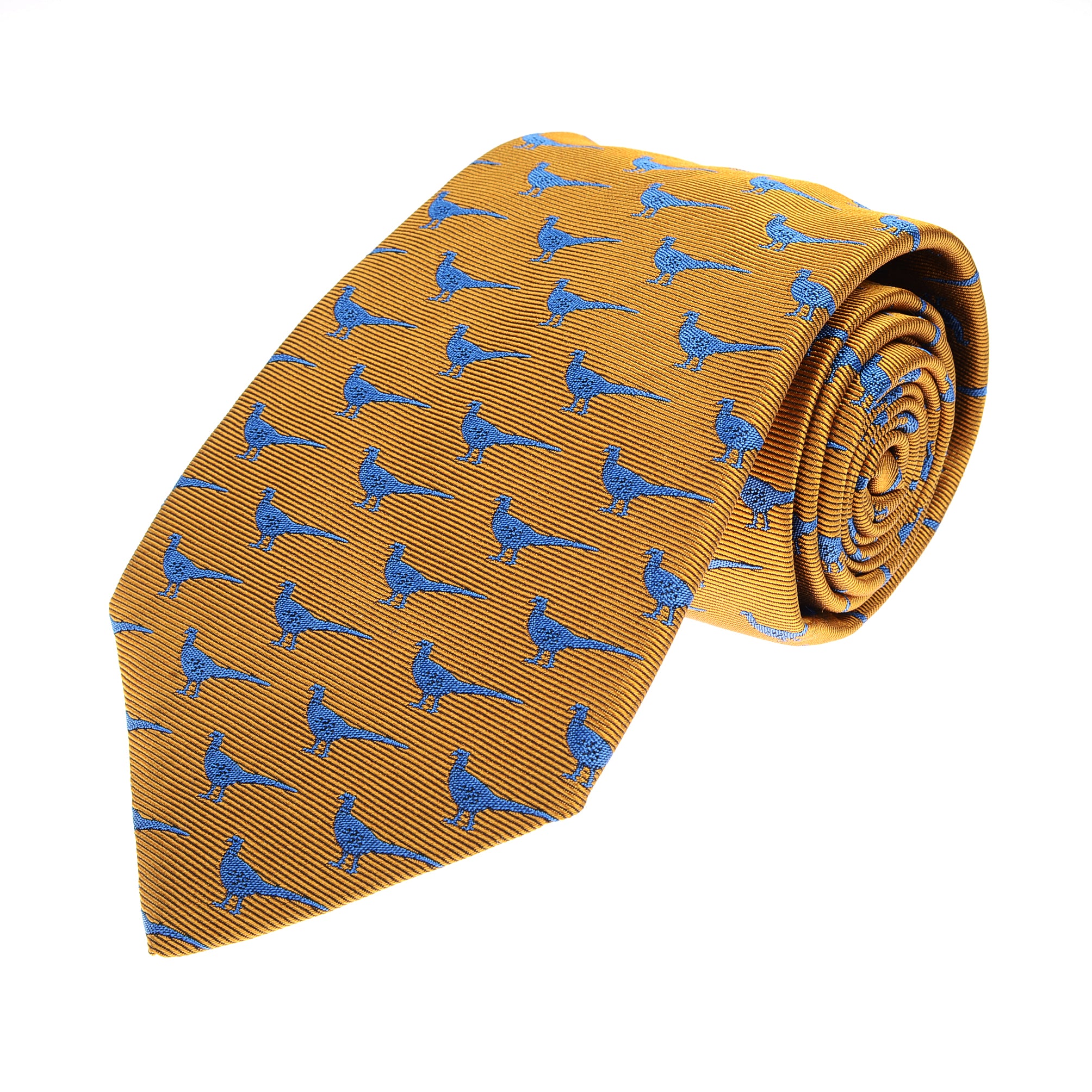 The Pheasant Silk Tie by Campbells of Beauly features a repeating pattern of small blue pheasants on gold silk, neatly rolled and displayed against a white background, offering a playful yet elegant touch.