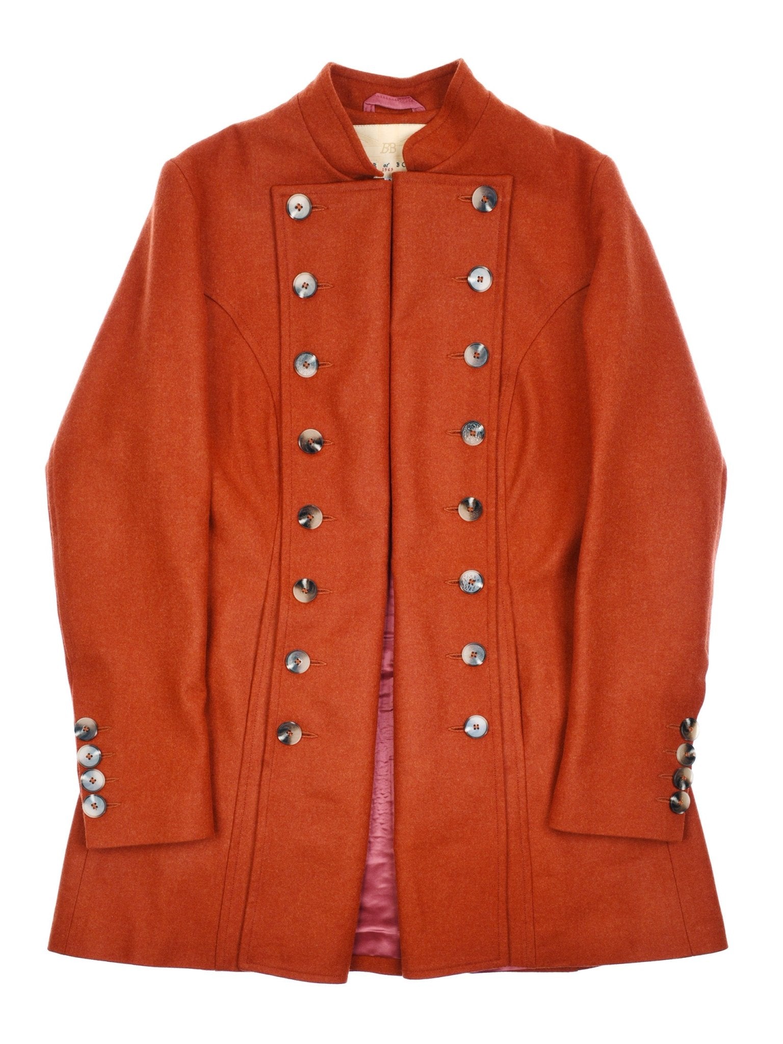 The Pirate Coat by Campbells of Beauly is a long, double-breasted burnt orange coat with ten large silver front buttons, three on each cuff, a high collar, fitted shape, and silky pink lining visible at the inner edges.