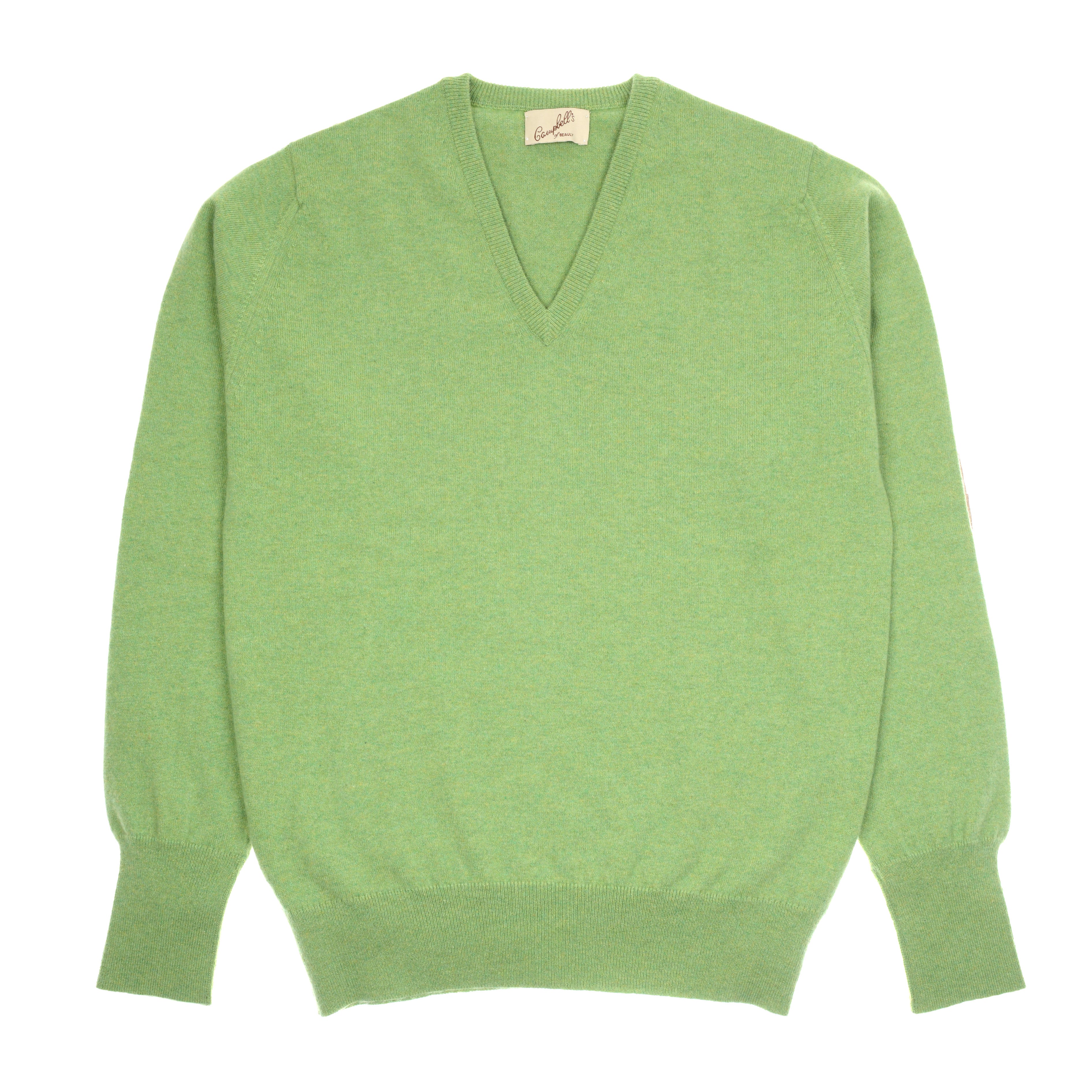 A light green, slim fit Cashmere V-Neck Jumper by Campbells of Beauly is laid flat on a white background. This fine-knit sweater features ribbed cuffs and hem, a visible neck tag, and soft, luxurious Scottish cashmere fabric.