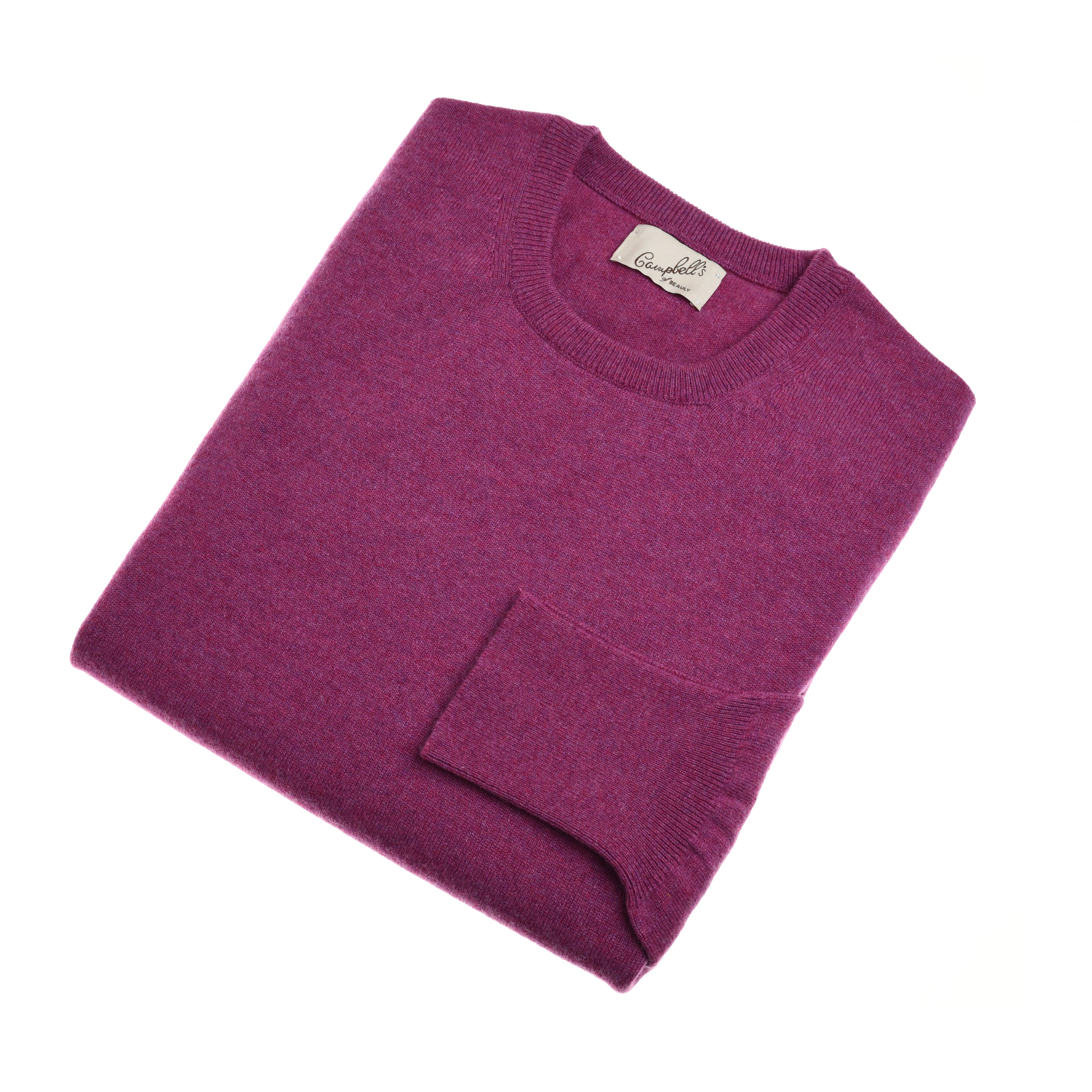 A folded, long-sleeved Campbells of Beauly Cashmere Crew Neck Jumper in rich magenta lies on a white background, showcasing lightweight warmth, luxurious feel, and the brand label visible inside the collar.