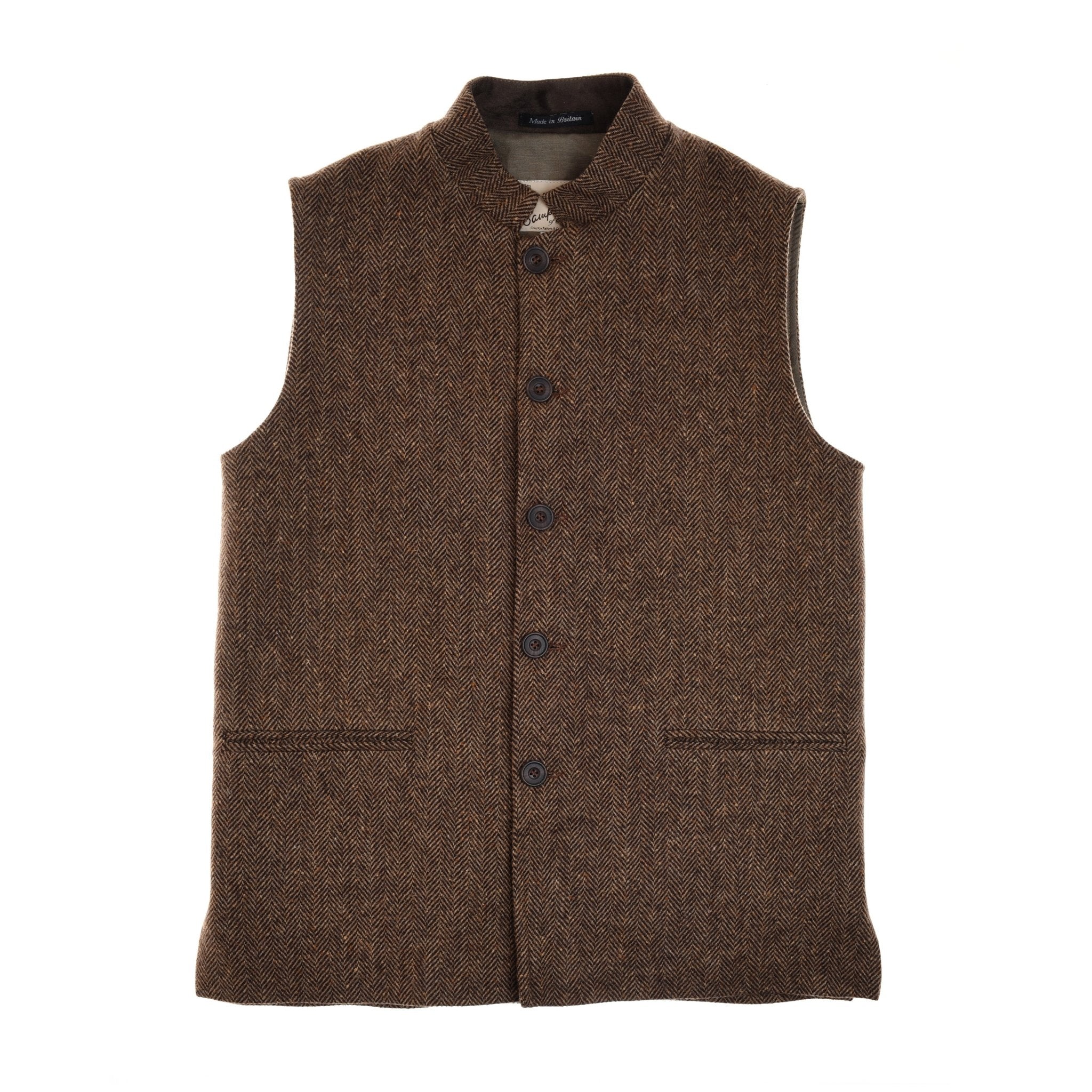 The Campbells of Beauly Tweed Nehru Gilet in brown herringbone is a sleeveless wool vest with a stand collar, five buttons, and two horizontal slit pockets, shown laid flat on a white background.