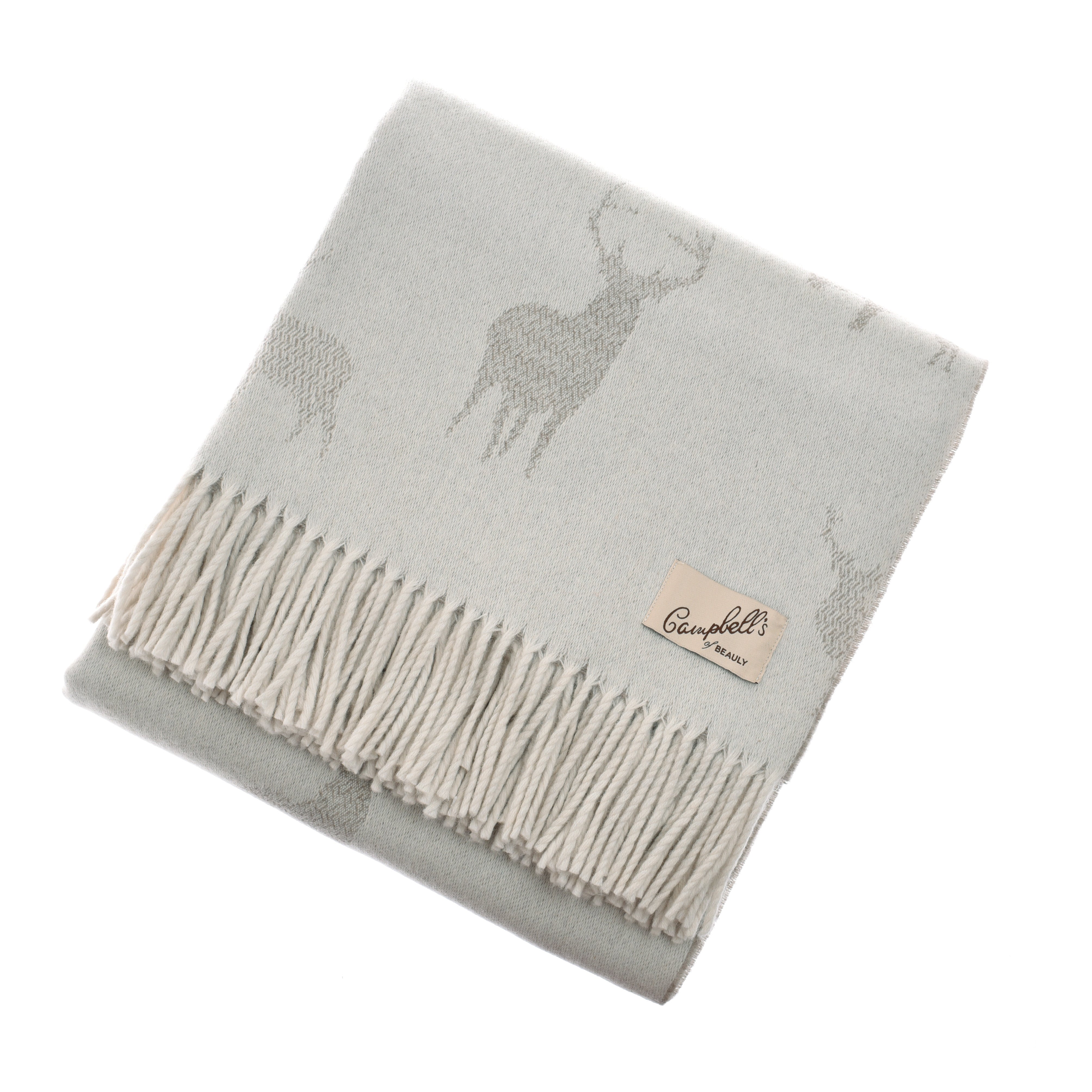 The Stag Lambswool Blanket by Campbells of Beauly, woven in Scotland, is light gray with a subtle stag pattern, fringed edges, and a beige brand label stitched on the corner. Displayed folded on a white background.