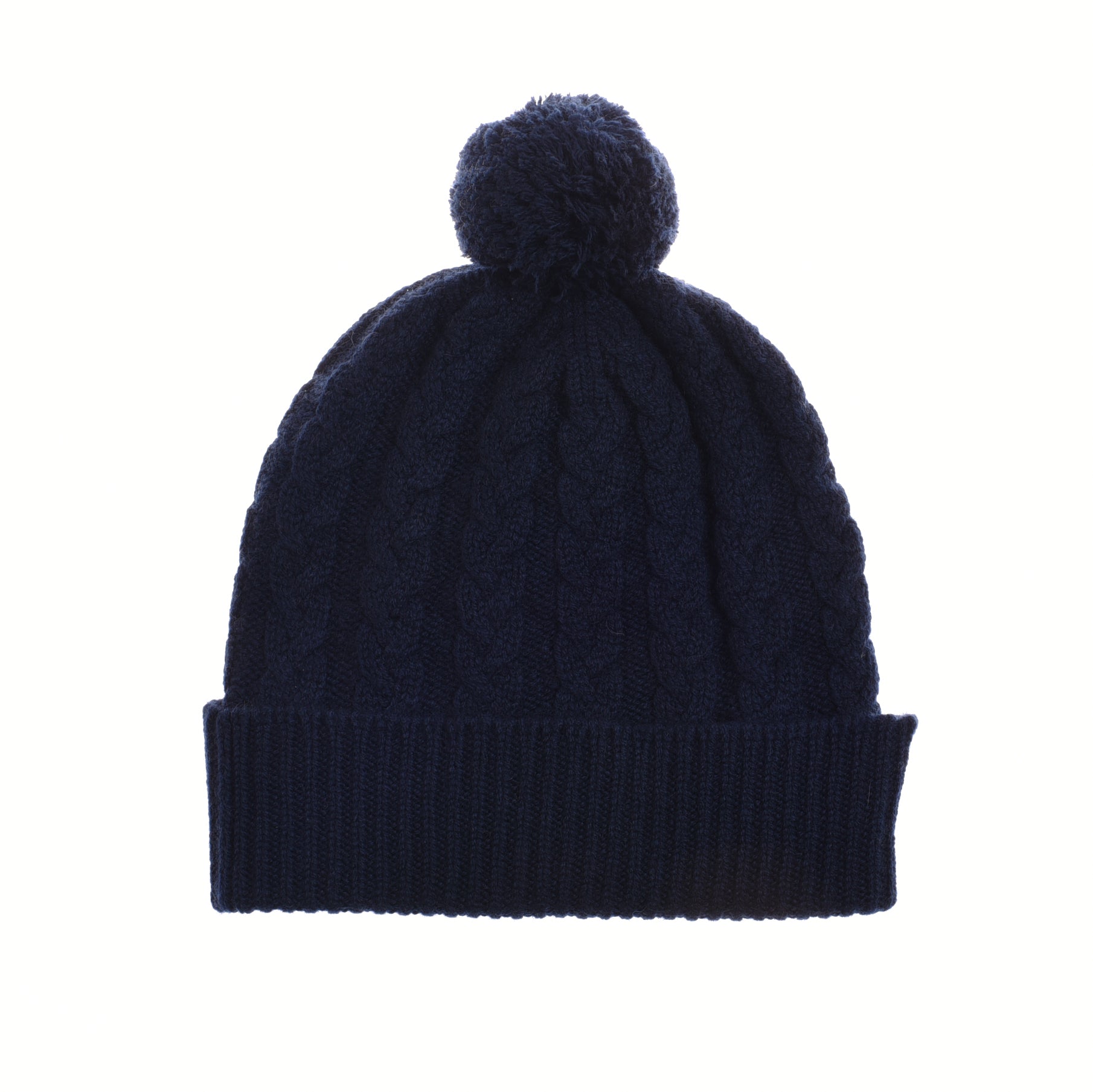 The Chunky Cable Cashmere Hat with Pom Pom by Campbells of Beauly is a navy blue winter accessory with a ribbed fold-over cuff, large pom-pom, and chunky cable design, offering cozy textured knit style against a white background.