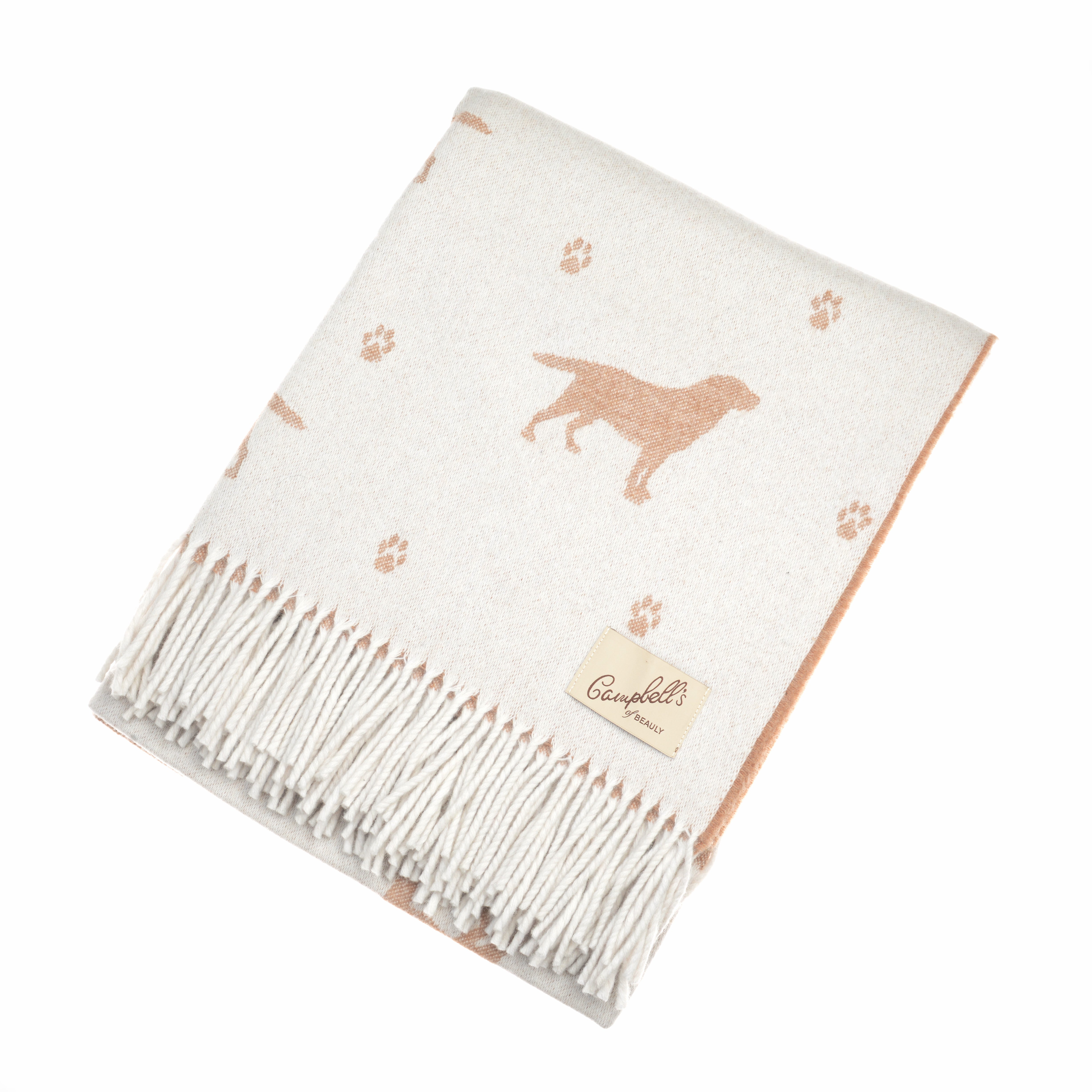 The Labrador Lambswool Blanket by Campbells of Beauly is a cream wool throw with light brown dog and paw prints, long fringes, and a sewn beige label—perfect for dog lovers wanting softness, comfort, and playful style.