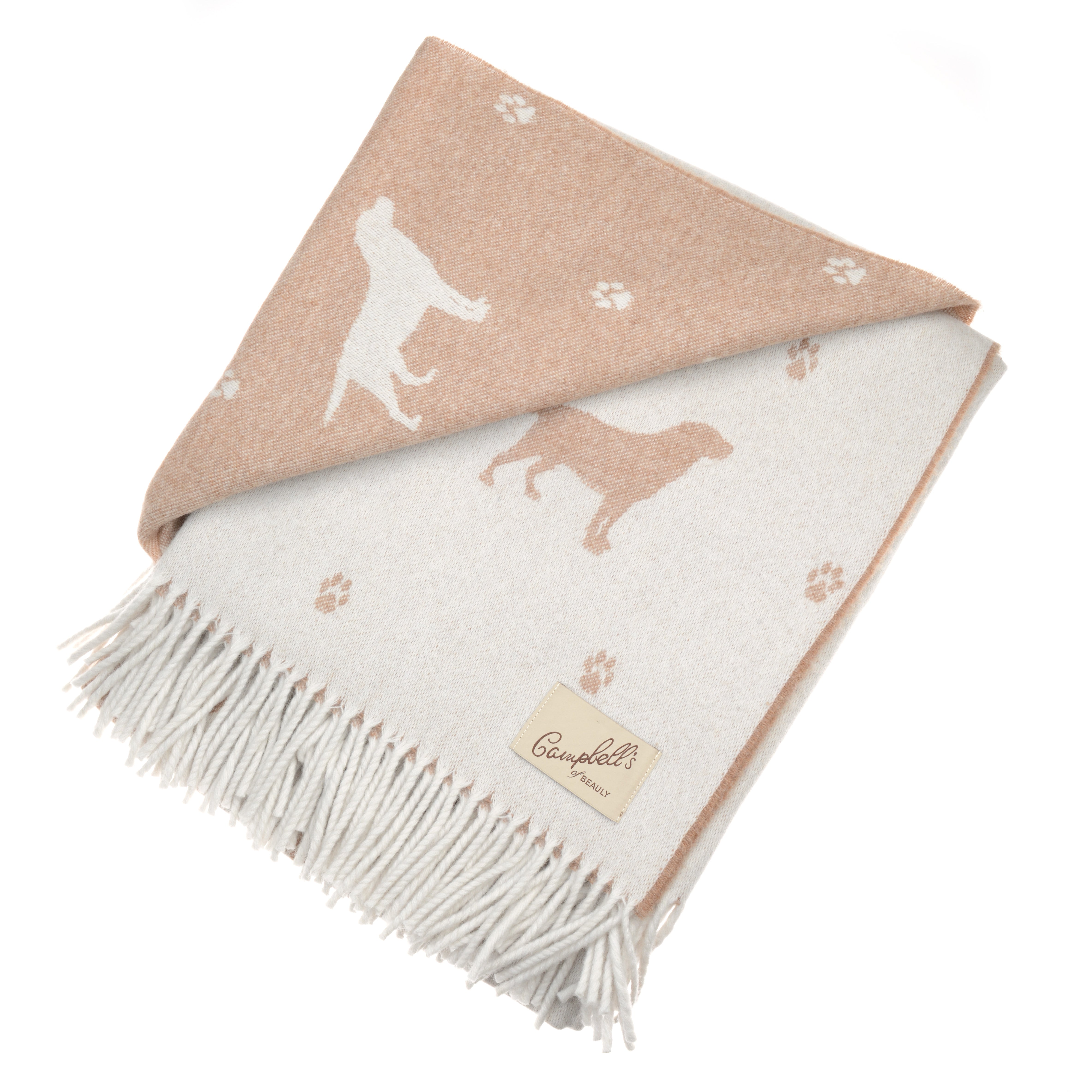 A folded, fringed lambswool blanket in beige and off-white features Labrador silhouettes and paw prints—ideal for dog lovers. Finished with a branded beige label from Campbells of Beauly. Crafted in Scotland.