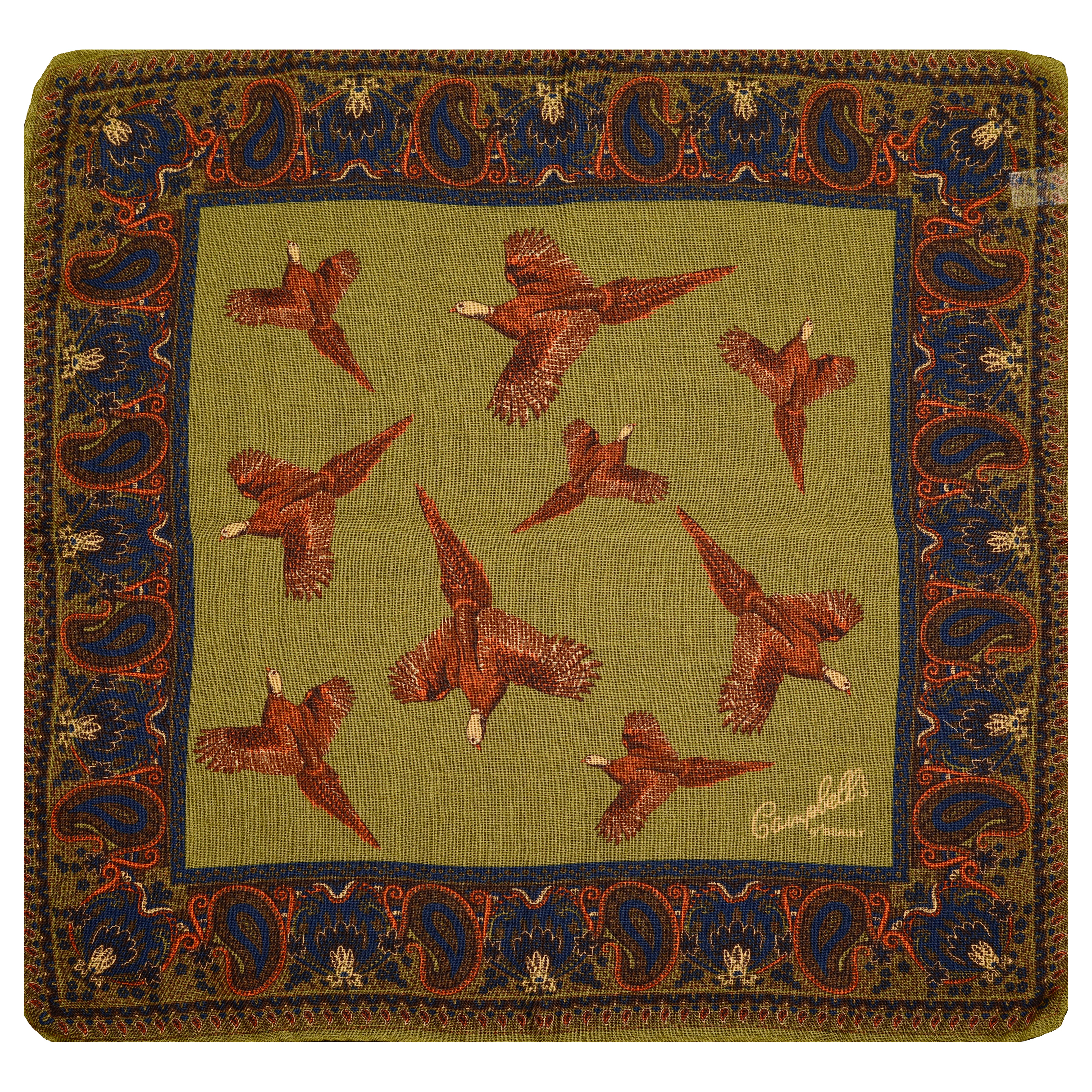 The Wool & Silk Hank by Campbells of Beauly is an olive-green square pocket square featuring a blue and red paisley border, eight red pheasants, hand-rolled edges, and a white “Campbell’s” signature in the lower right corner.