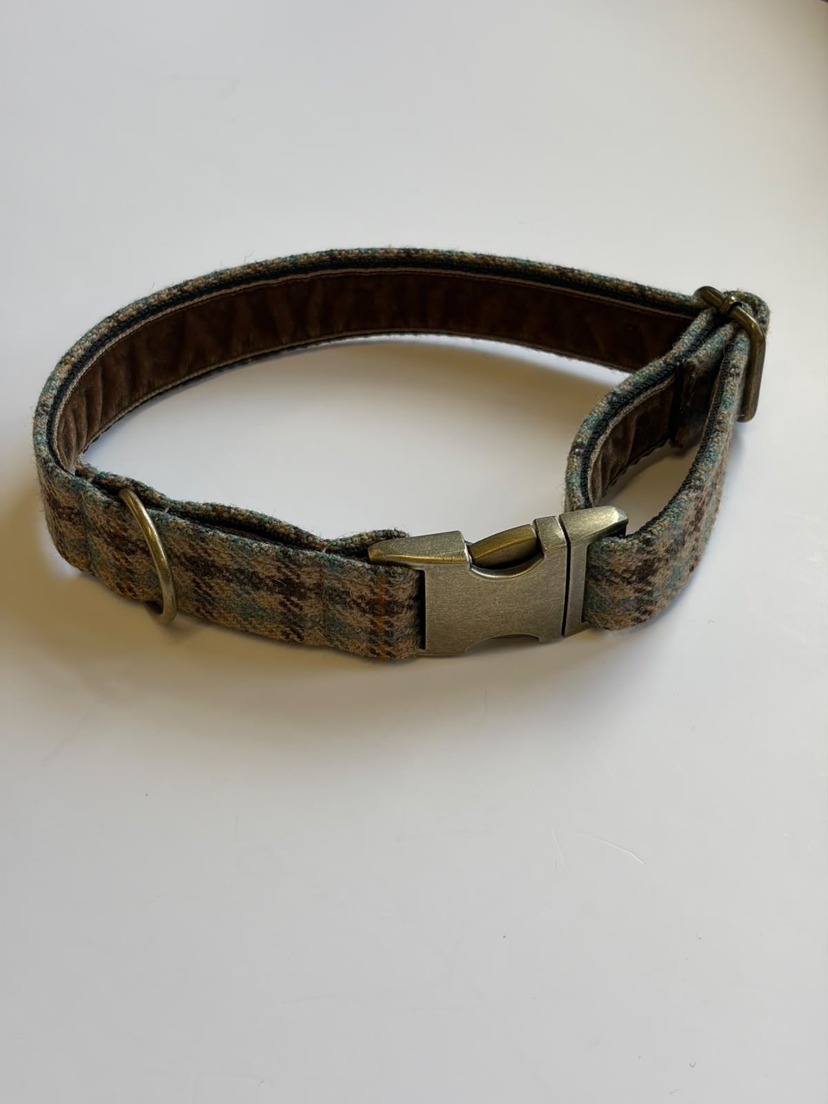 A Campbell's of Beauly House Tweed Dog Collar, featuring a metal buckle and D-ring, displayed on a white surface.