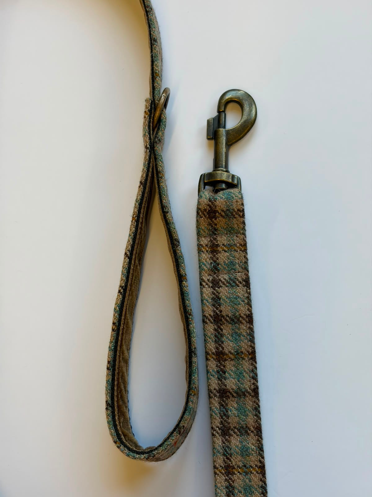 The House Tweed Dog Lead by Campbell's of Beauly, featuring a classic plaid pattern, loop handle, and metal clasp, is shown laid flat on a plain white background.