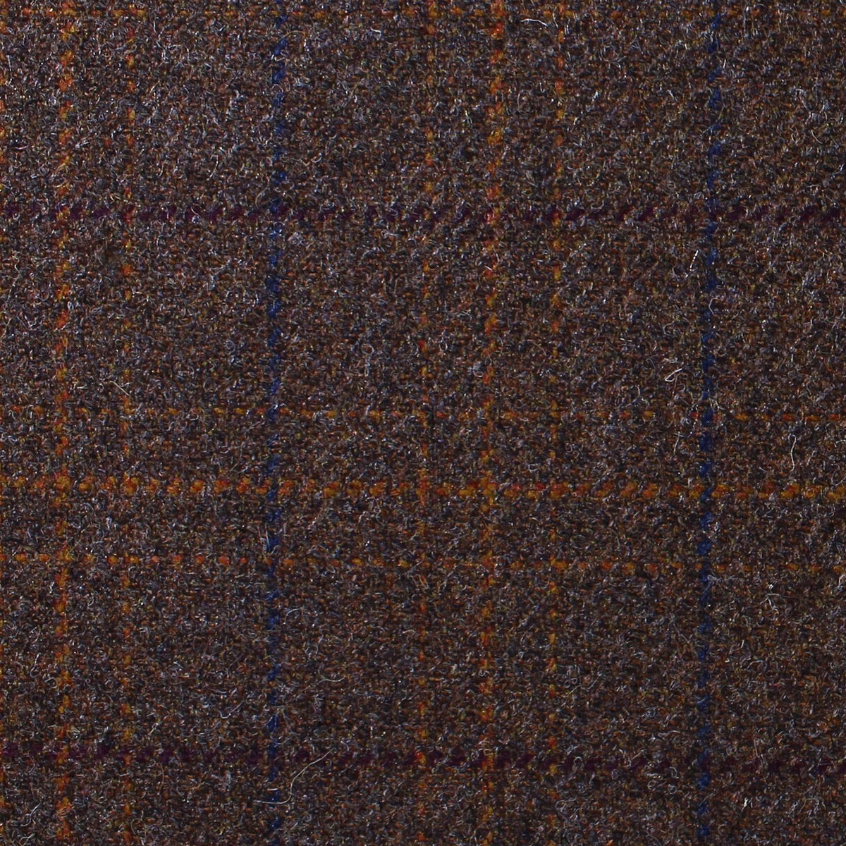 Estate Tweed 023 is a heavyweight sporting cloth in dark brown wool tweed featuring a subtle orange and blue windowpane check pattern.