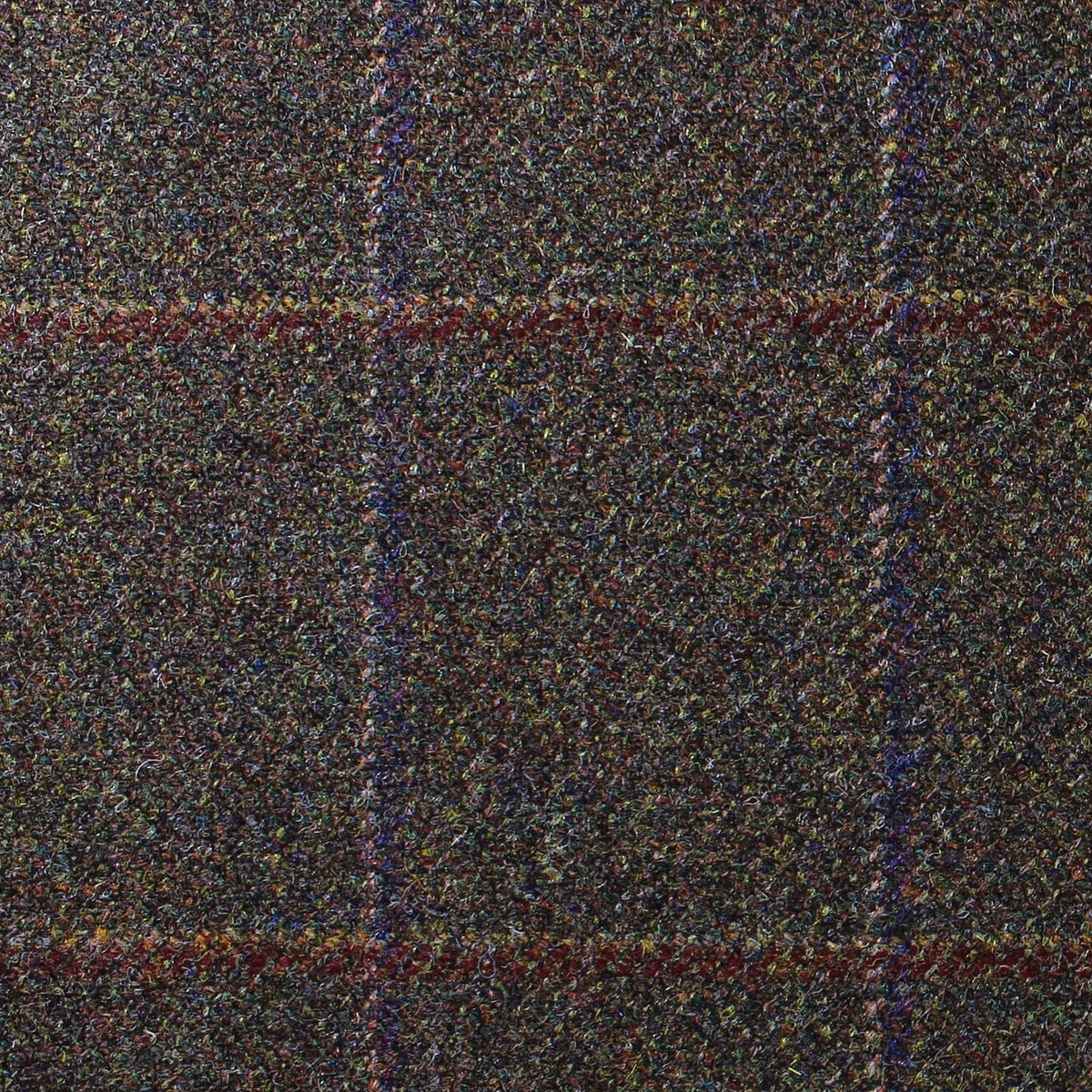 Lovat Mill Estate Tweed 034 is a dark brown estate weight tweed with a multicolored flecked texture and a large, faint plaid pattern in red and blue.