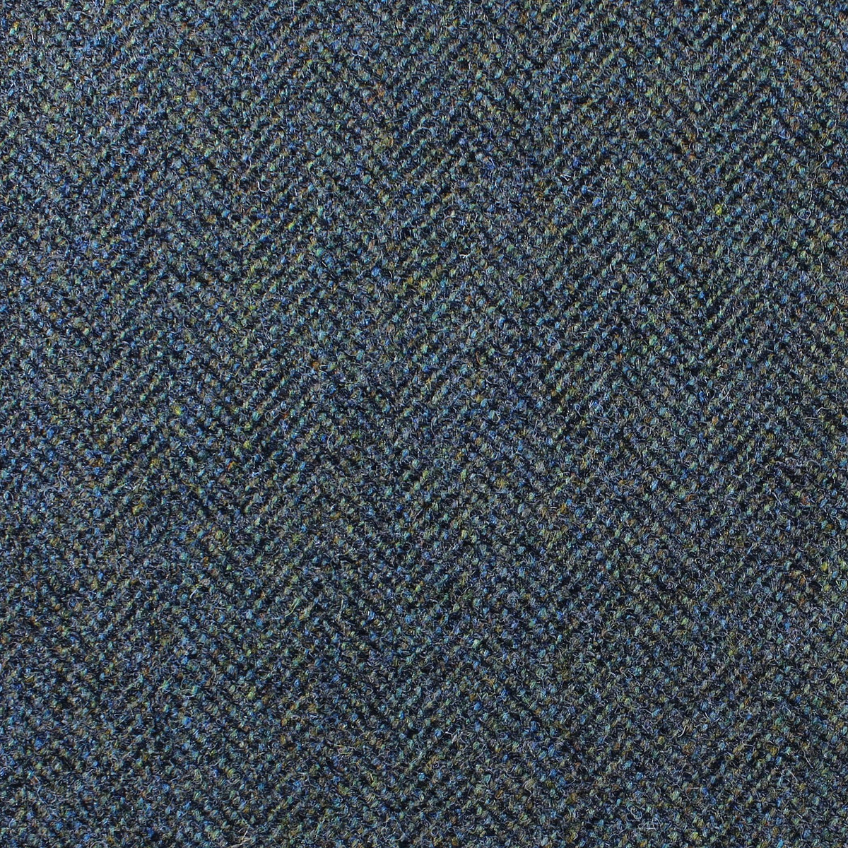 Estate Tweed 040 heavyweight dark blue and green estate tweed fabric in a herringbone pattern.