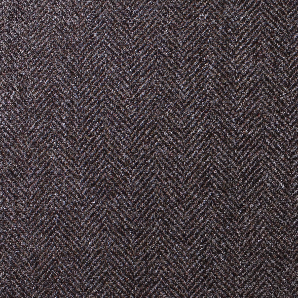 Close-up of Estate Tweed 041 in a heavyweight dark brown herringbone pattern.