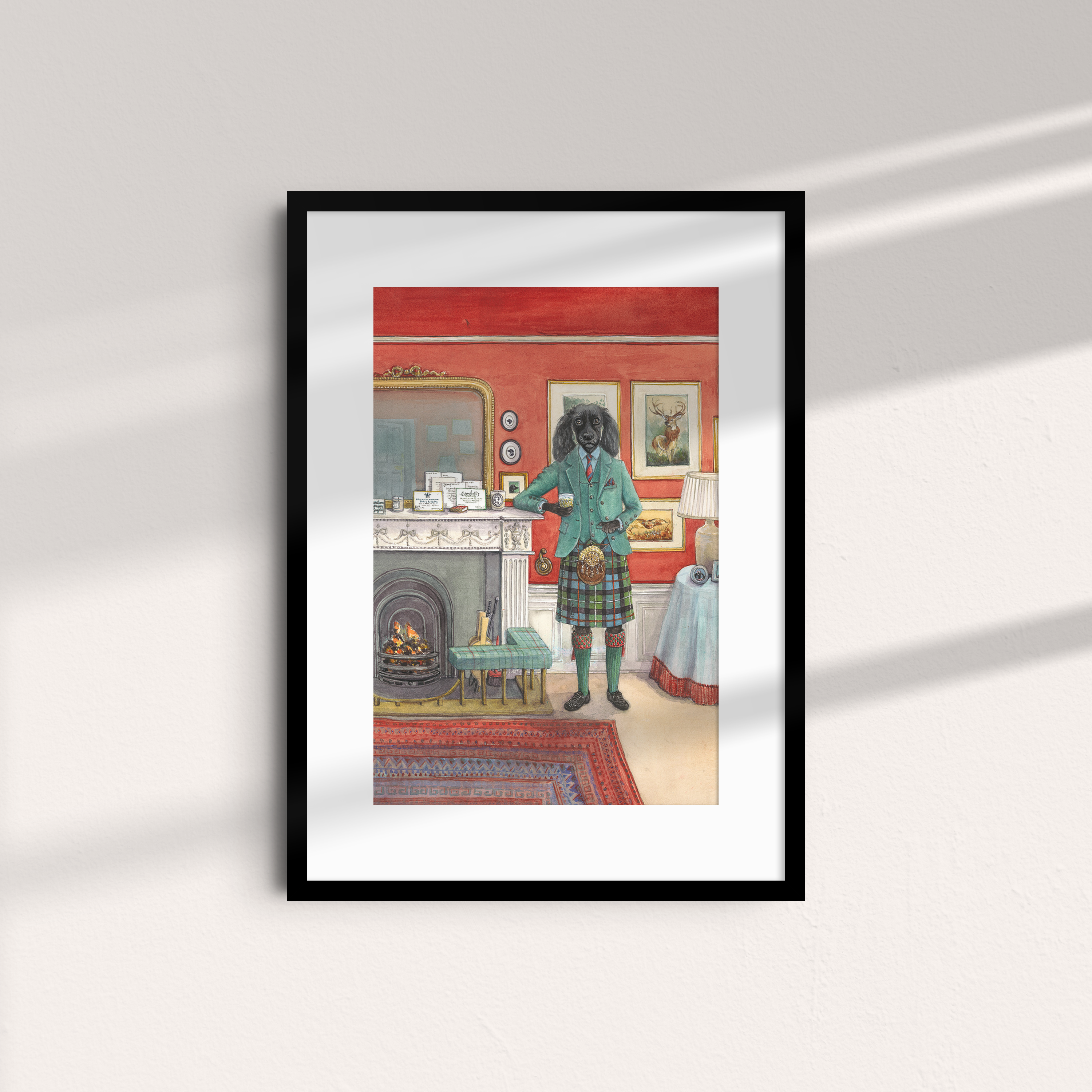 Fireside Dram Unframed Print by Campbells of Beauly features an exclusive Sophie Murray illustration of an anthropomorphic black dog in Scottish attire, set in a red living room with a fireplace and sunlight on the white wall.