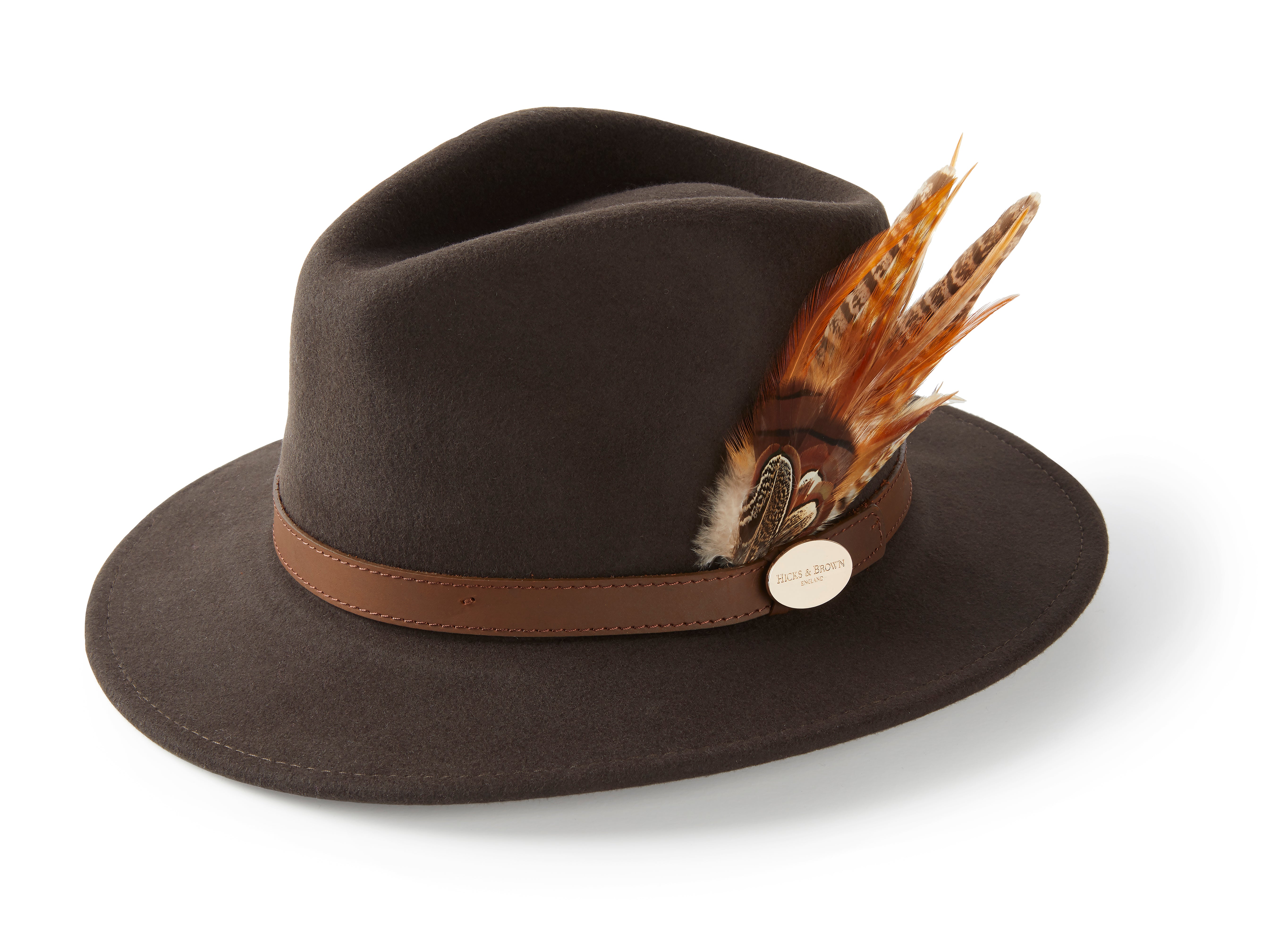 The Hicks & Brown Gamebird Fedora features water-resistant wool felt, a wide brim, brown leather hatband, gold “Orvis 1856” medallion, and a right-side feather wrap in brown, orange, and white for a stylish accent to this classic hat.
