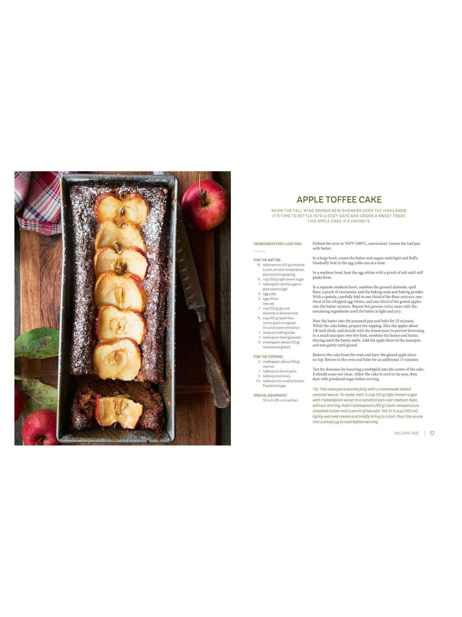 A rectangular toffee cake with baked apple slices sits in a loaf pan, next to the Highland Harvest Book by Campbell's of Beauly, shown on a white background. Red apples and a knife surround the cake.