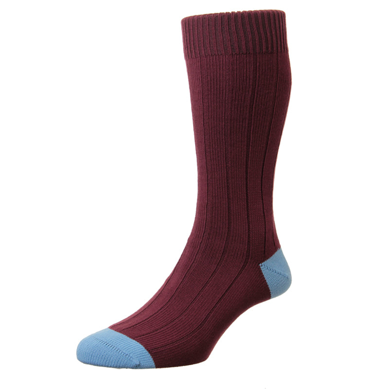 A single Oxford Sock by Campbells of Beauly, UK-made in ribbed maroon cotton with light blue toe and heel. The sock stands upright, showcasing its full length, elastic cuff, and contrasting durable design features.