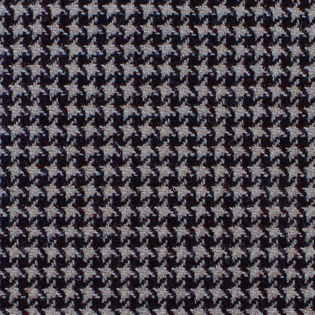Estate Tweed 006 heavyweight wool tweed featuring a small, dense houndstooth pattern in tan, black, and deep red.