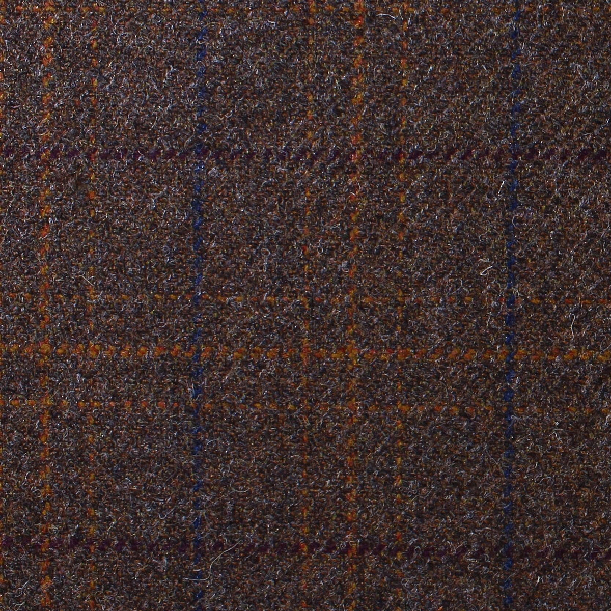 Estate Tweed 023 is a heavyweight sporting cloth in dark brown wool tweed featuring a subtle orange and blue windowpane check pattern.