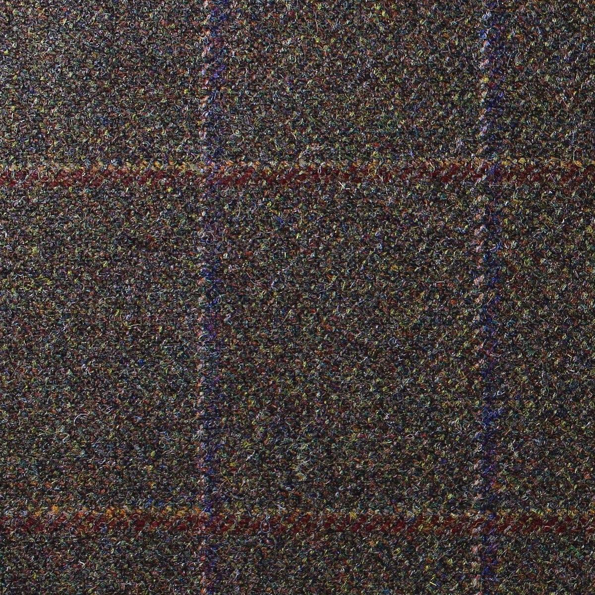 Lovat Mill Estate Tweed 034 is a dark brown estate weight tweed with a multicolored flecked texture and a large, faint plaid pattern in red and blue.