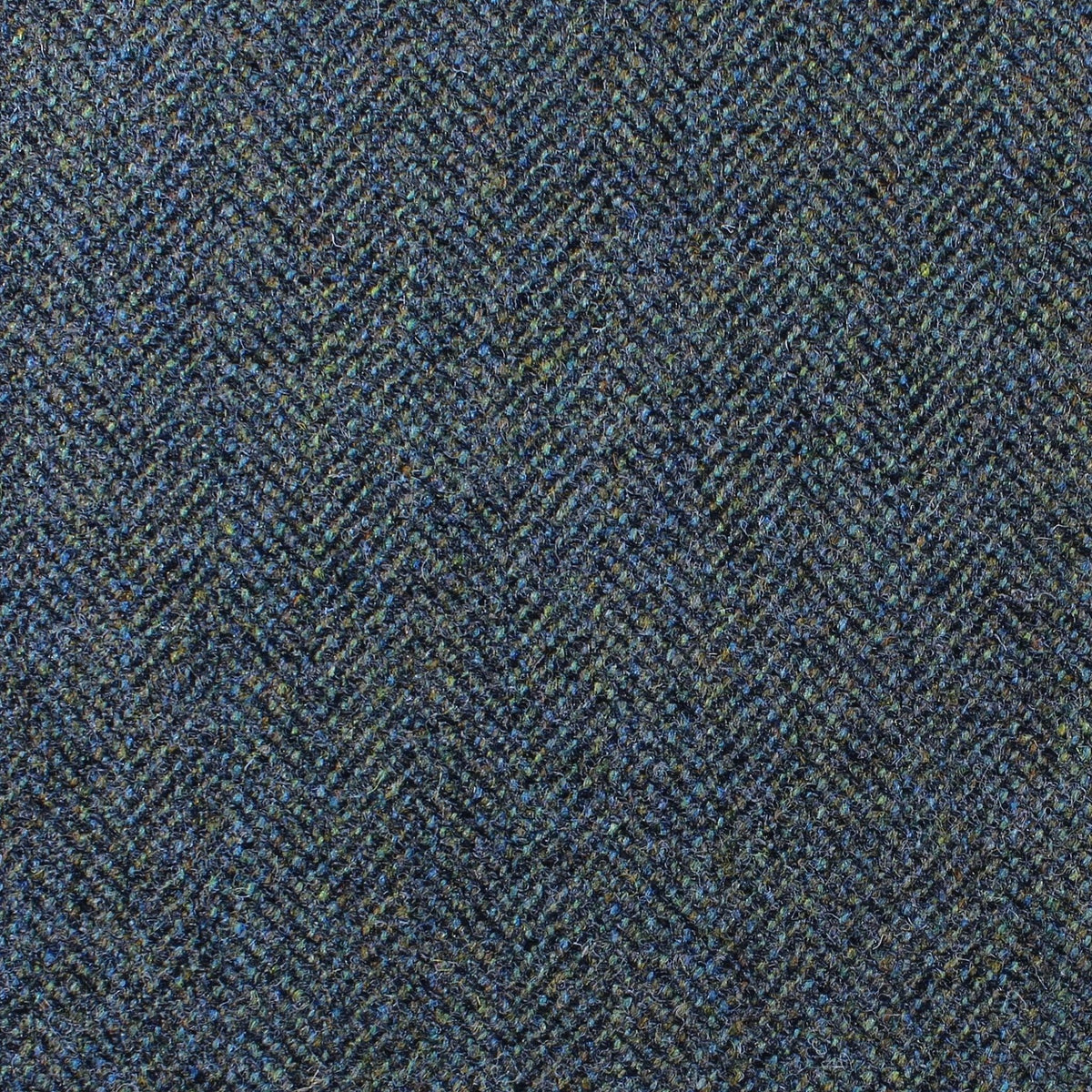 Estate Tweed 040 heavyweight dark blue and green estate tweed fabric in a herringbone pattern.