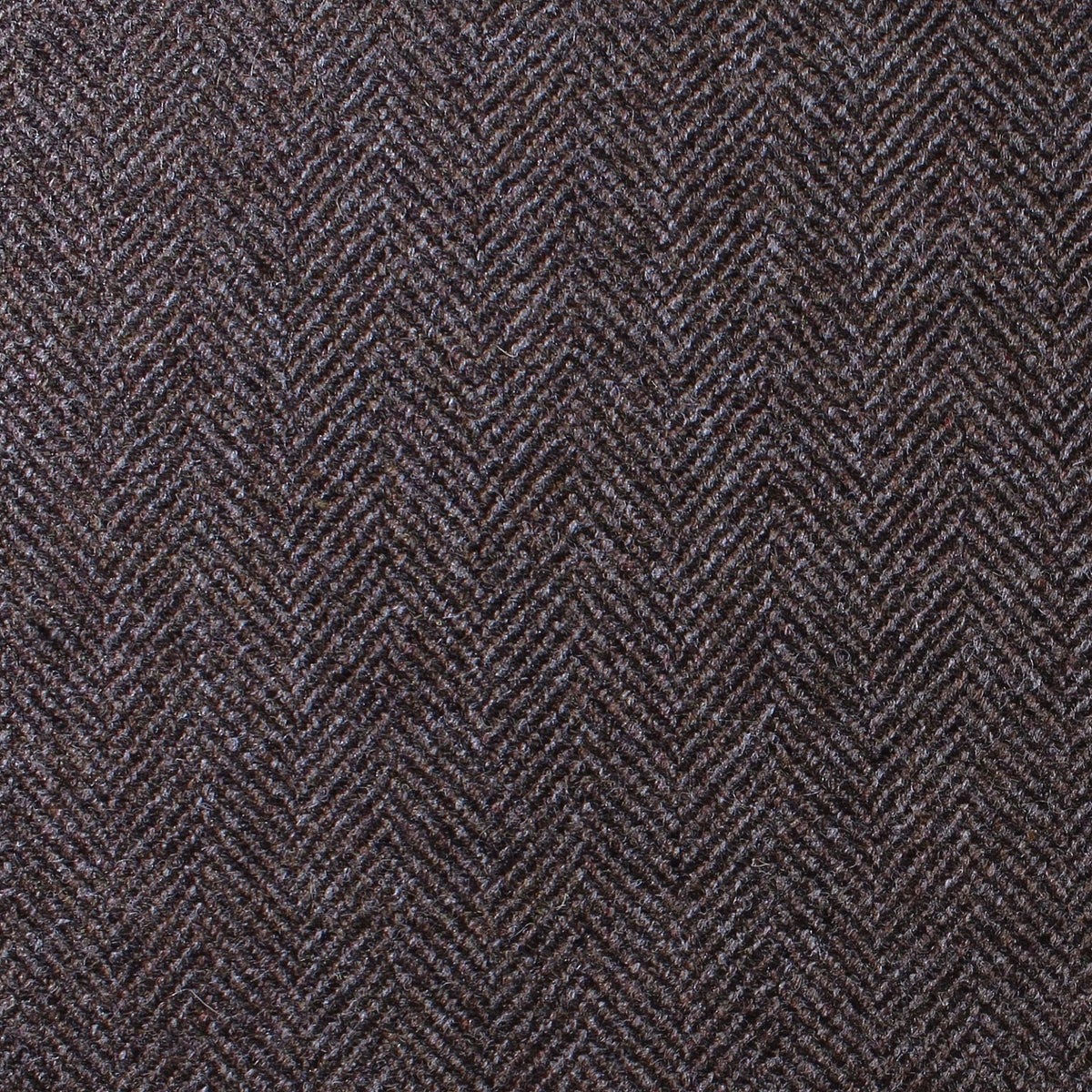 Close-up of Estate Tweed 041 in a heavyweight dark brown herringbone pattern.