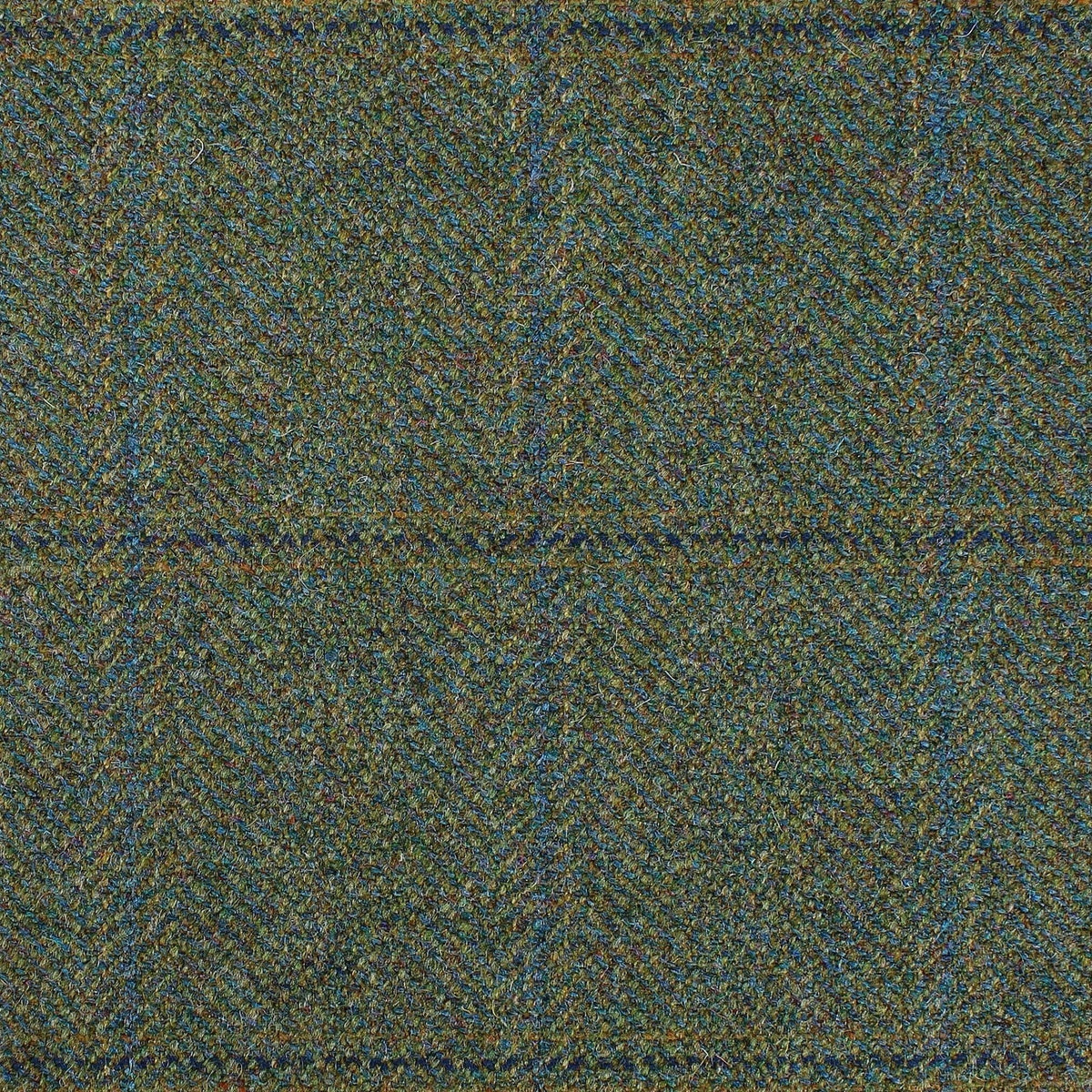 Estate Tweed 076 heavyweight estate tweed in green wool featuring a multicolored herringbone weave and a large blue windowpane check pattern.
