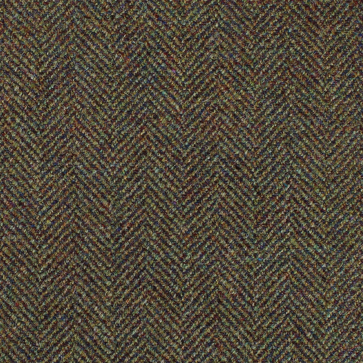 Lovat Mill Estate Tweed 077 heavyweight multi-colored fabric in shades of brown, green, and blue with a classic herringbone pattern.