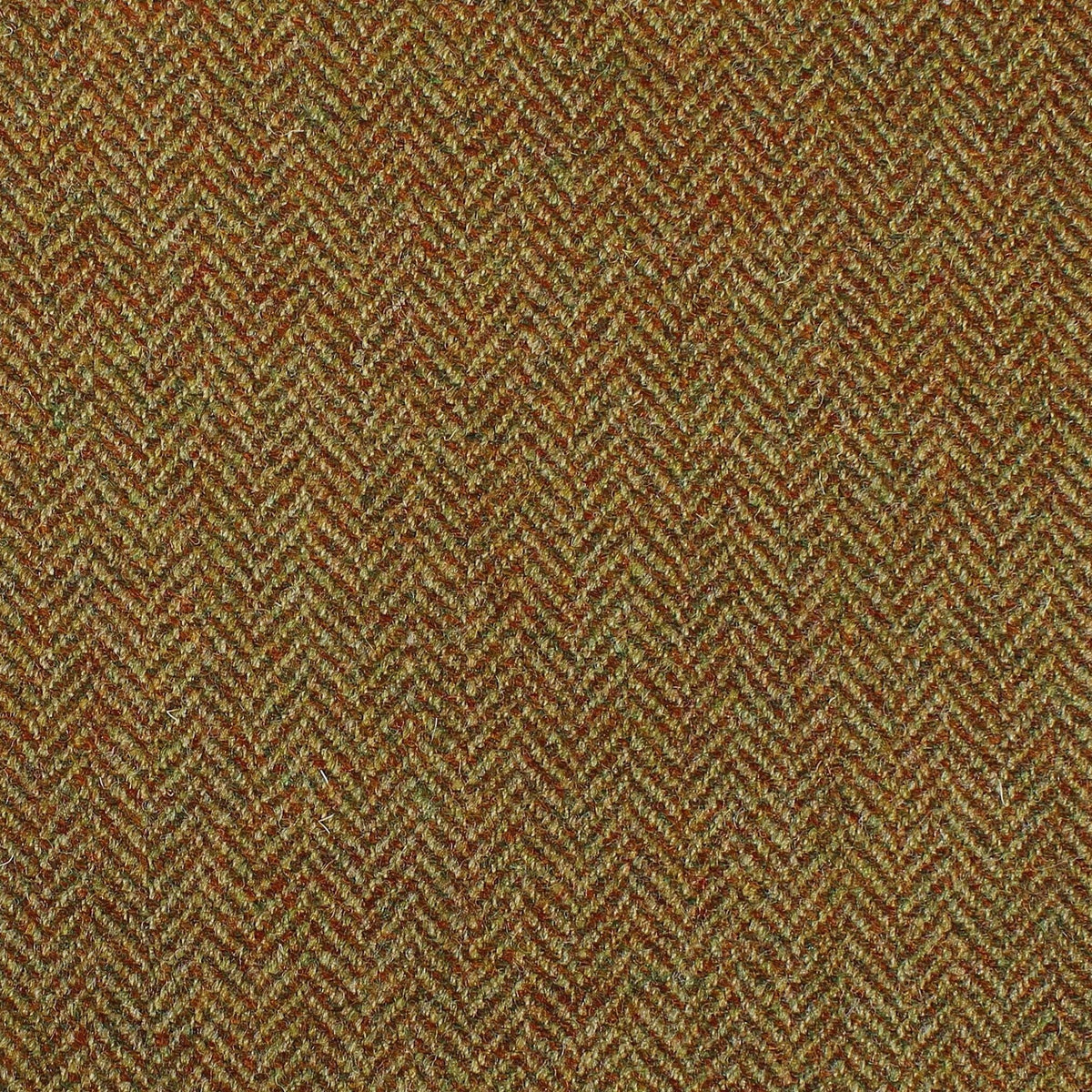 Close-up of Lovat Mill Estate Tweed 079, a brown, orange, and green fabric with a classic herringbone weave.