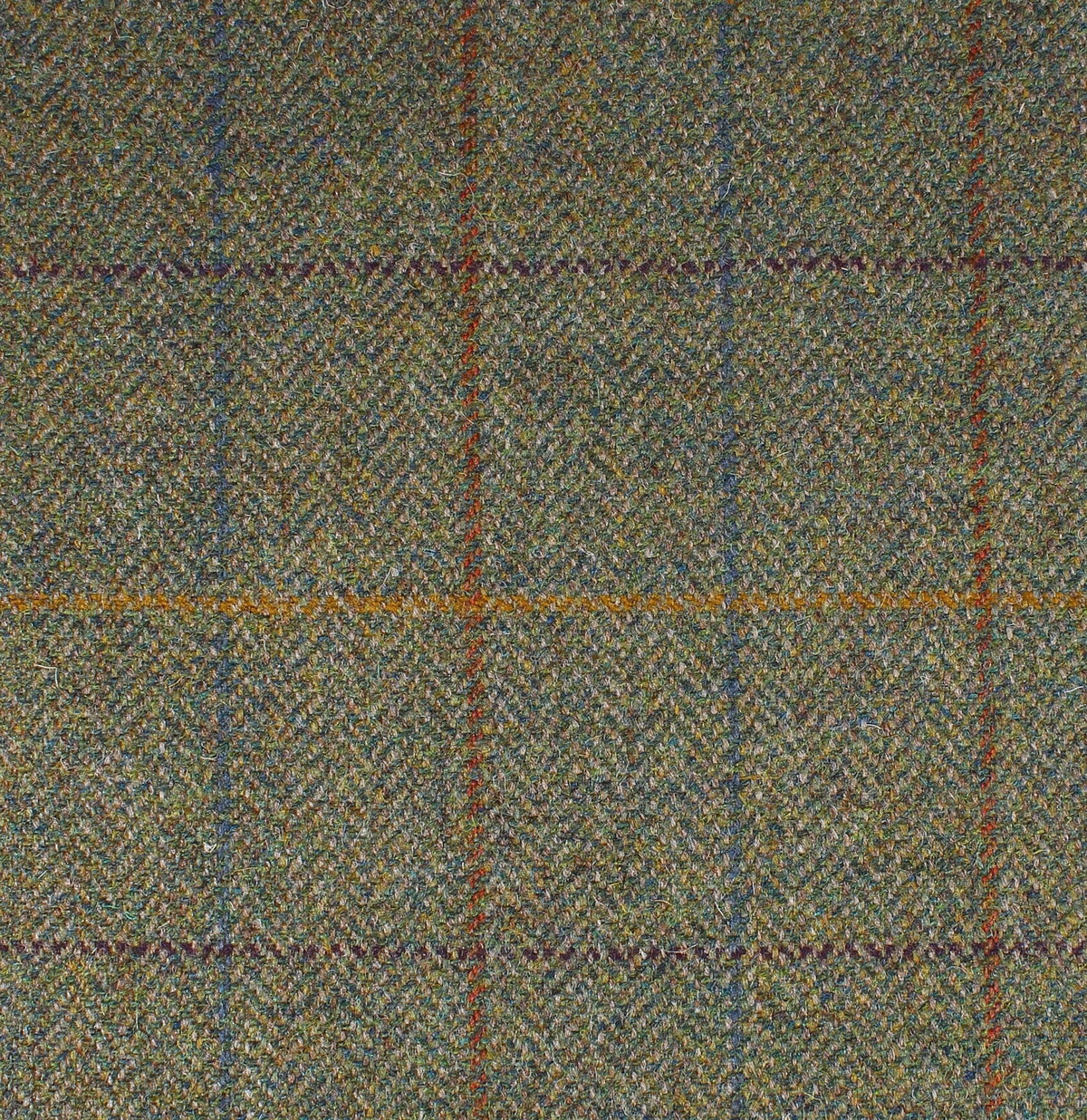 Field Tweed 095 green Scottish tweed fabric with a subtle herringbone pattern and an orange and blue overcheck.