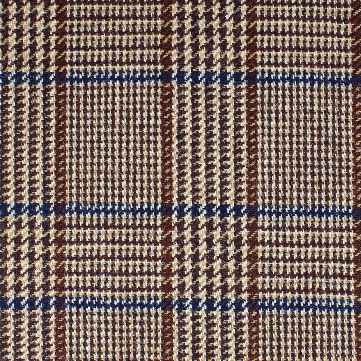 Field Tweed 103 Scottish tweed fabric in a brown, tan, and dark blue classic plaid pattern.