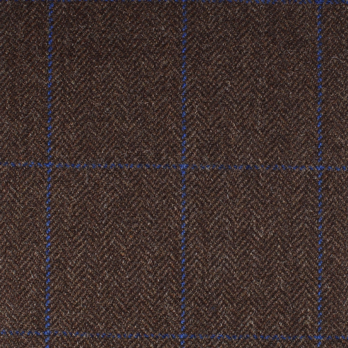Field Tweed 117 brown Scottish tweed herringbone wool fabric with a blue windowpane check pattern.